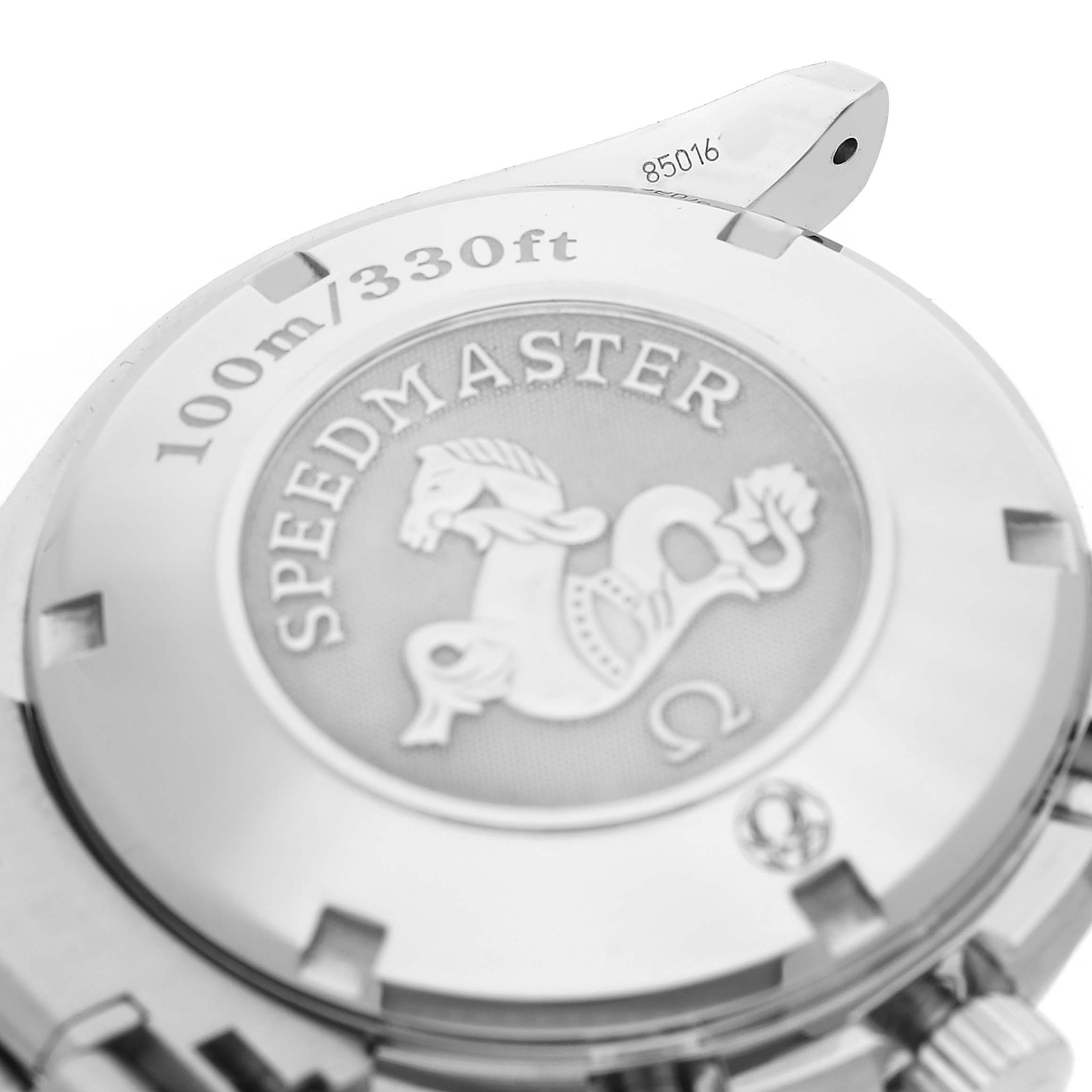 The image shows the back case and engraving of the Omega Speedmaster 3211.30.00 Men's Stainless Steel Silver Dial, highlighting the "100m/330ft" marking and logo.