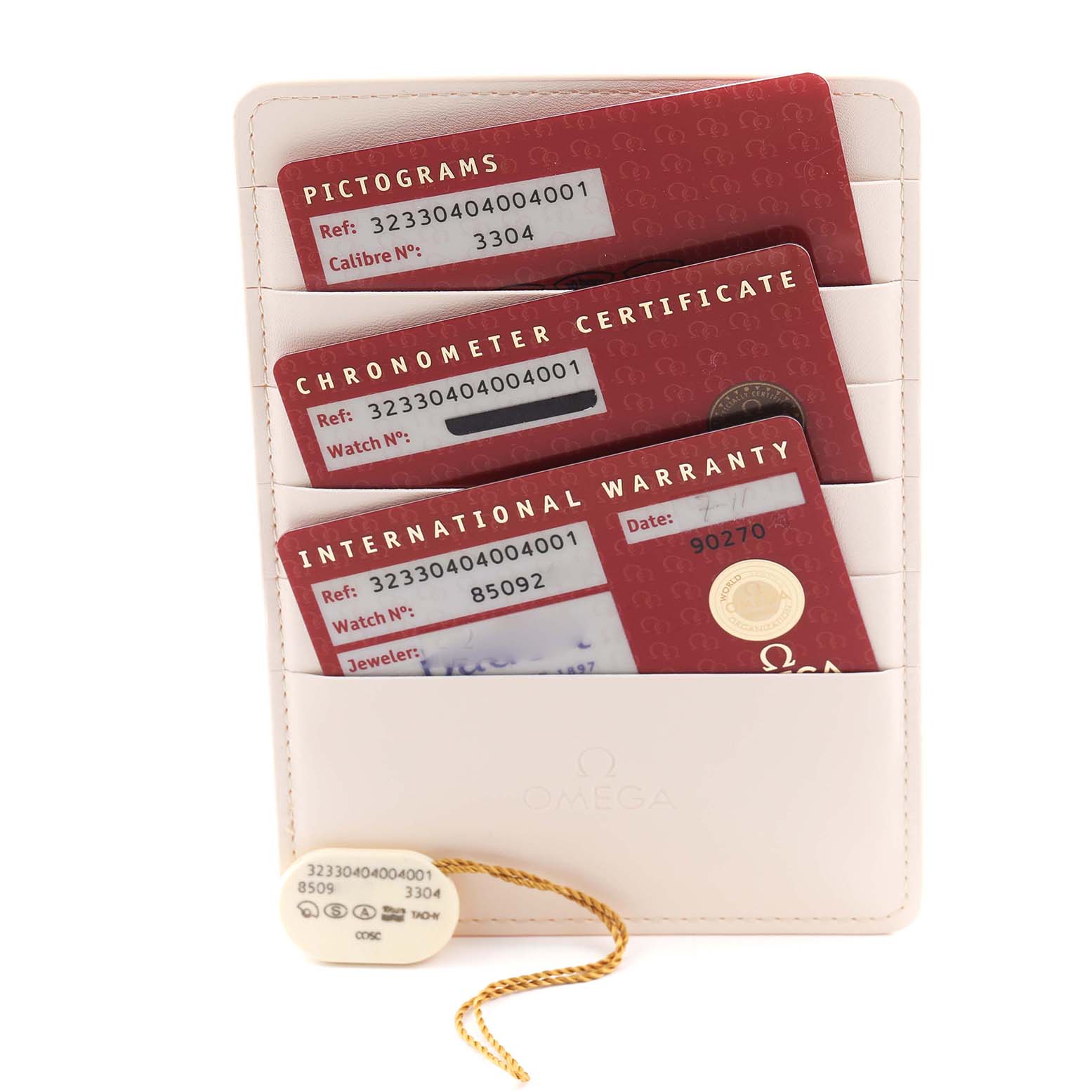 The image shows Omega Speedmaster 323.30.40.40.04.001 Men
s Stainless Steel White Dial 323.30.40.40.04.001 Men
s Stainless Steel White Dial warranty documents and tags at a straight-on angle.