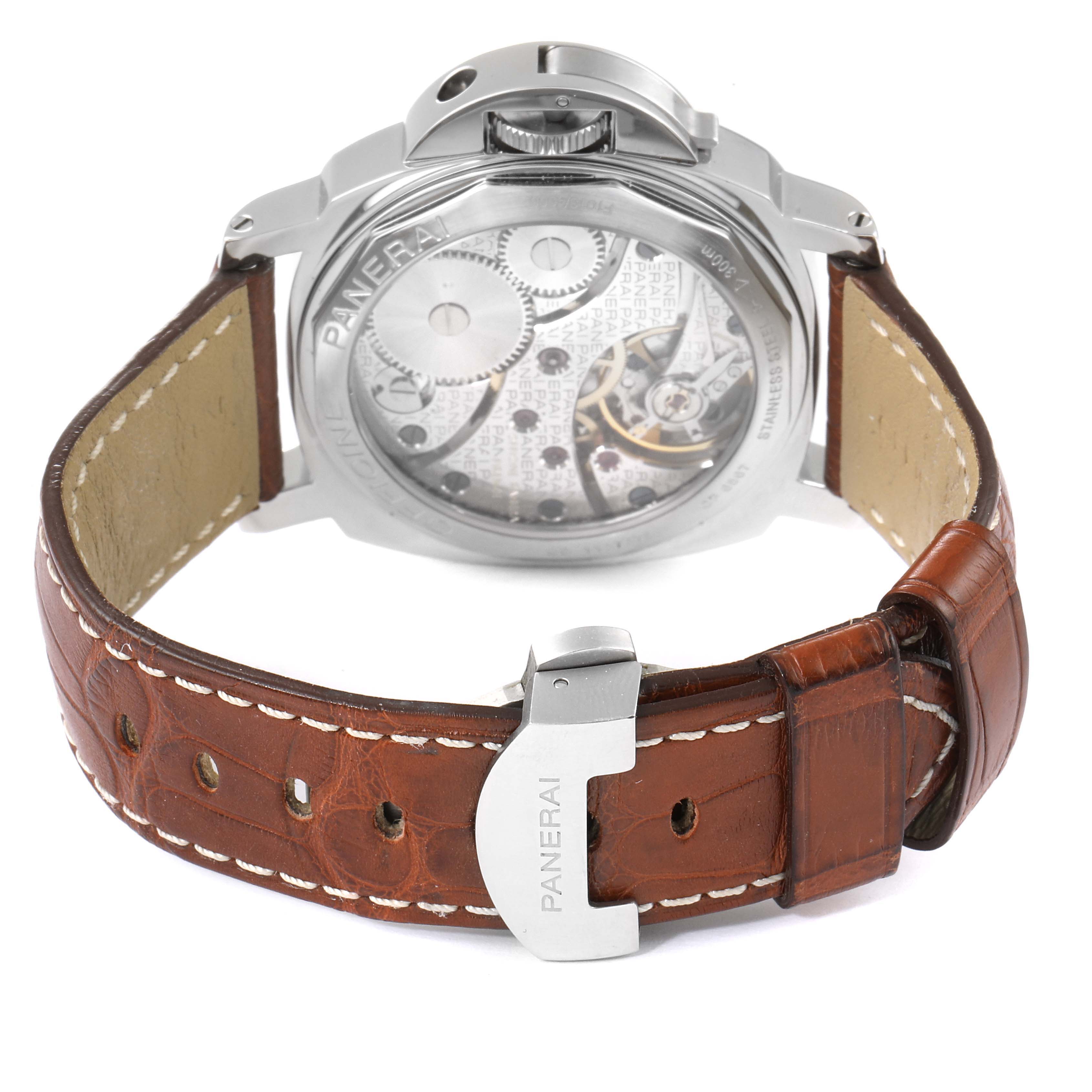 This image shows the back view of a Panerai Luminor PAM00113 Men
s Stainless Steel White Dial PAM00113 Men
s Stainless Steel White Dial watch, highlighting its intricate mechanical movement and brown leather strap.