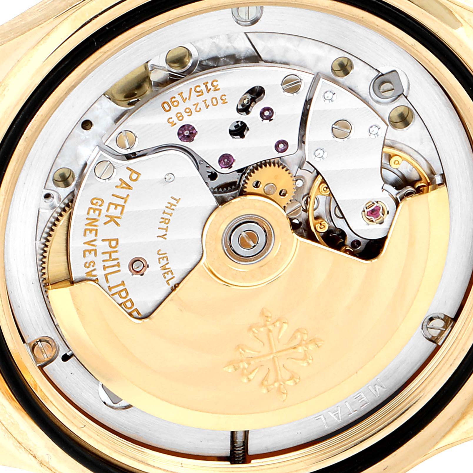 This image shows the intricate movement mechanism of the Patek Philippe Aquanaut 5065J Men's Yellow Gold Black Dial 5065J Men's Yellow Gold Black Dial watch from a back view angle.