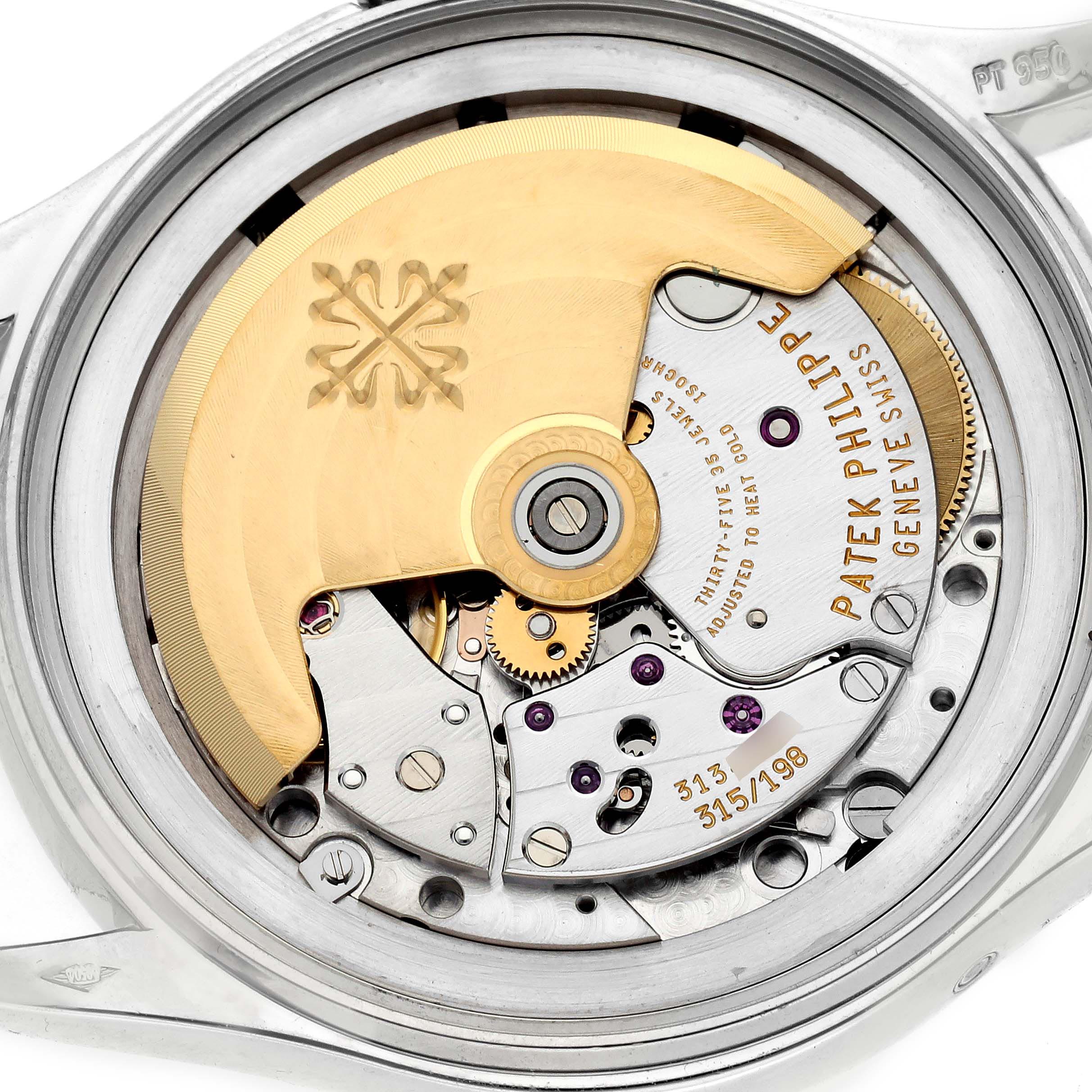 The image shows the back view of a Patek Philippe Complications 5035P-024 Men's Platinum Grey Dial 5035P-024 Men's Platinum Grey Dial watch, highlighting the intricate movement and mechanics.