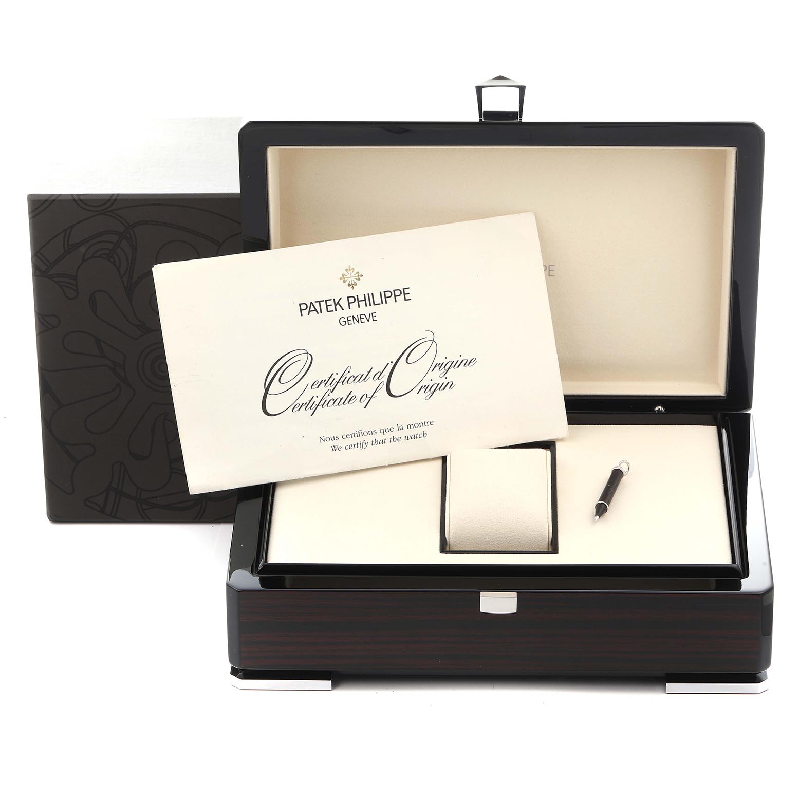 The image shows a Complications model by Patek Philippe in an open display box with a certificate and stylus visible.