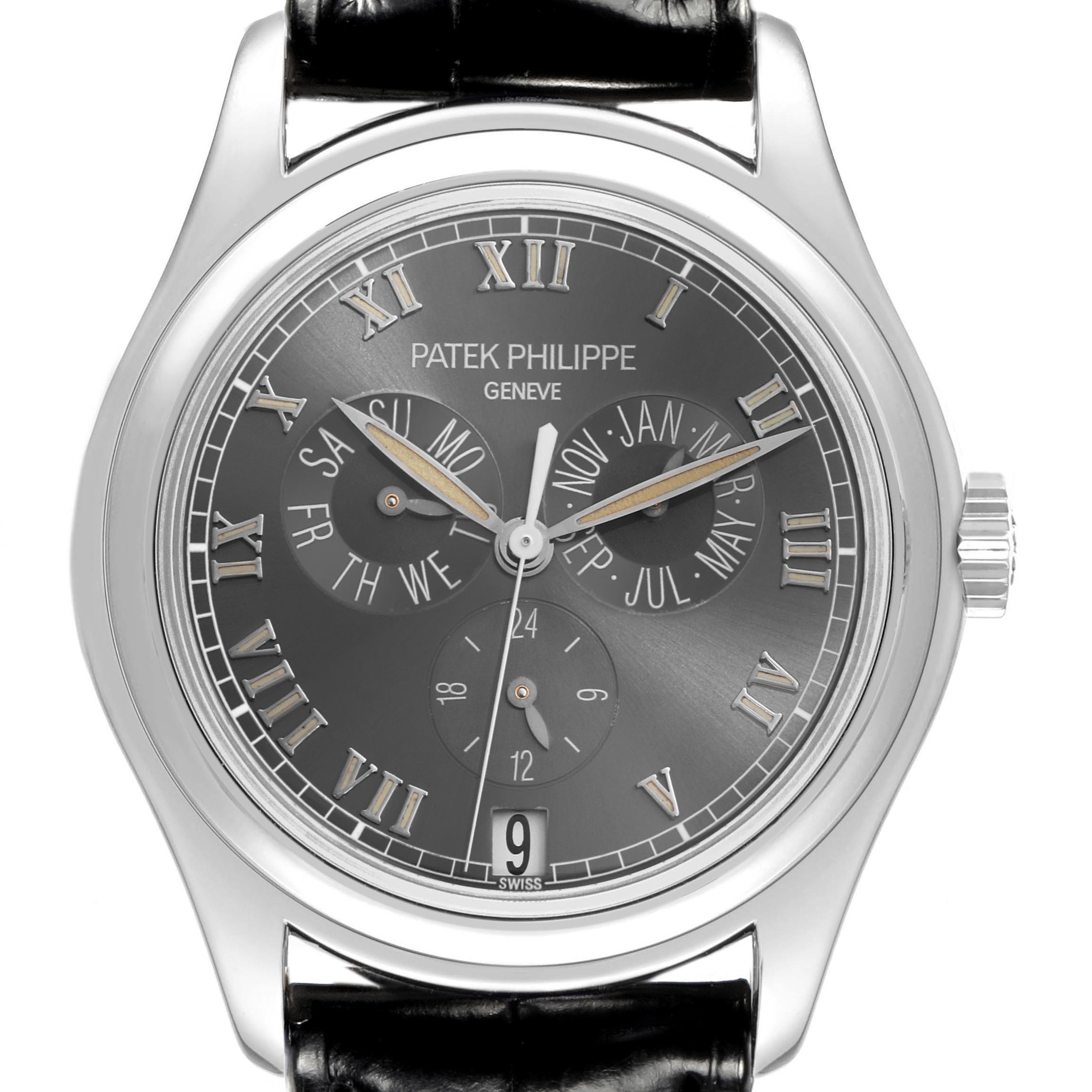 The Patek Philippe Complications 5035P-024 Men's Platinum Grey Dial 5035P-024 Men's Platinum Grey Dial watch is shown from a front angle, highlighting the dial, Roman numerals, subdials, and crown.