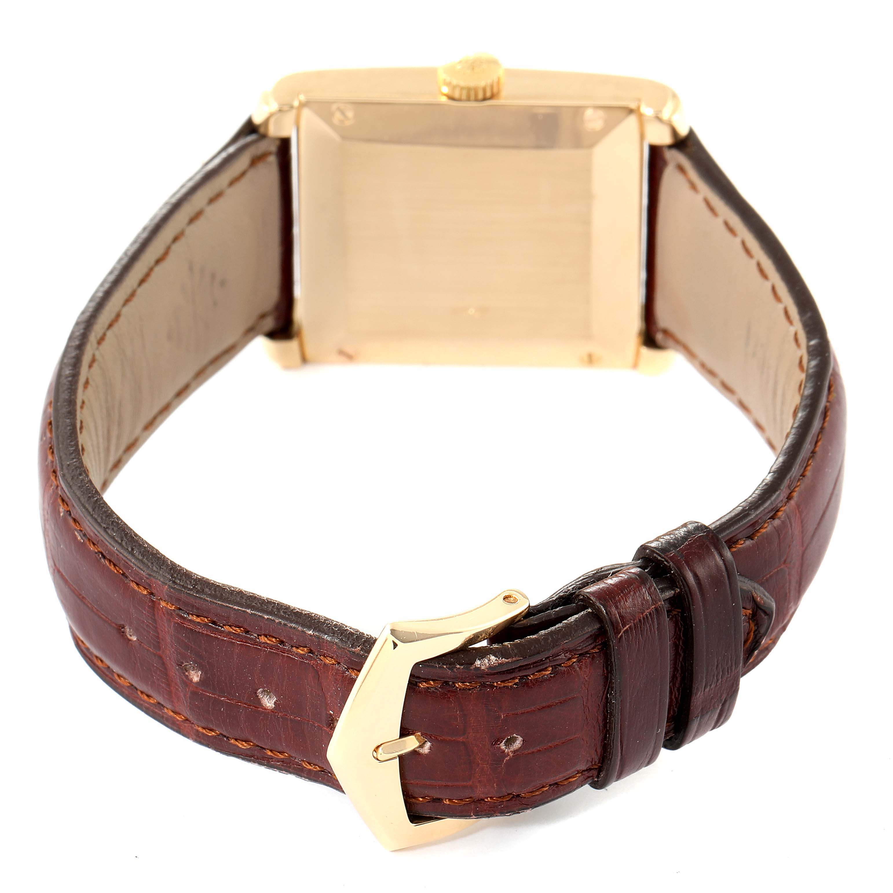 The image shows the back view of a Patek Philippe Gondolo 5014J Men's Yellow Gold White Dial 5014J Men's Yellow Gold White Dial watch with a leather strap and the watch's buckle.