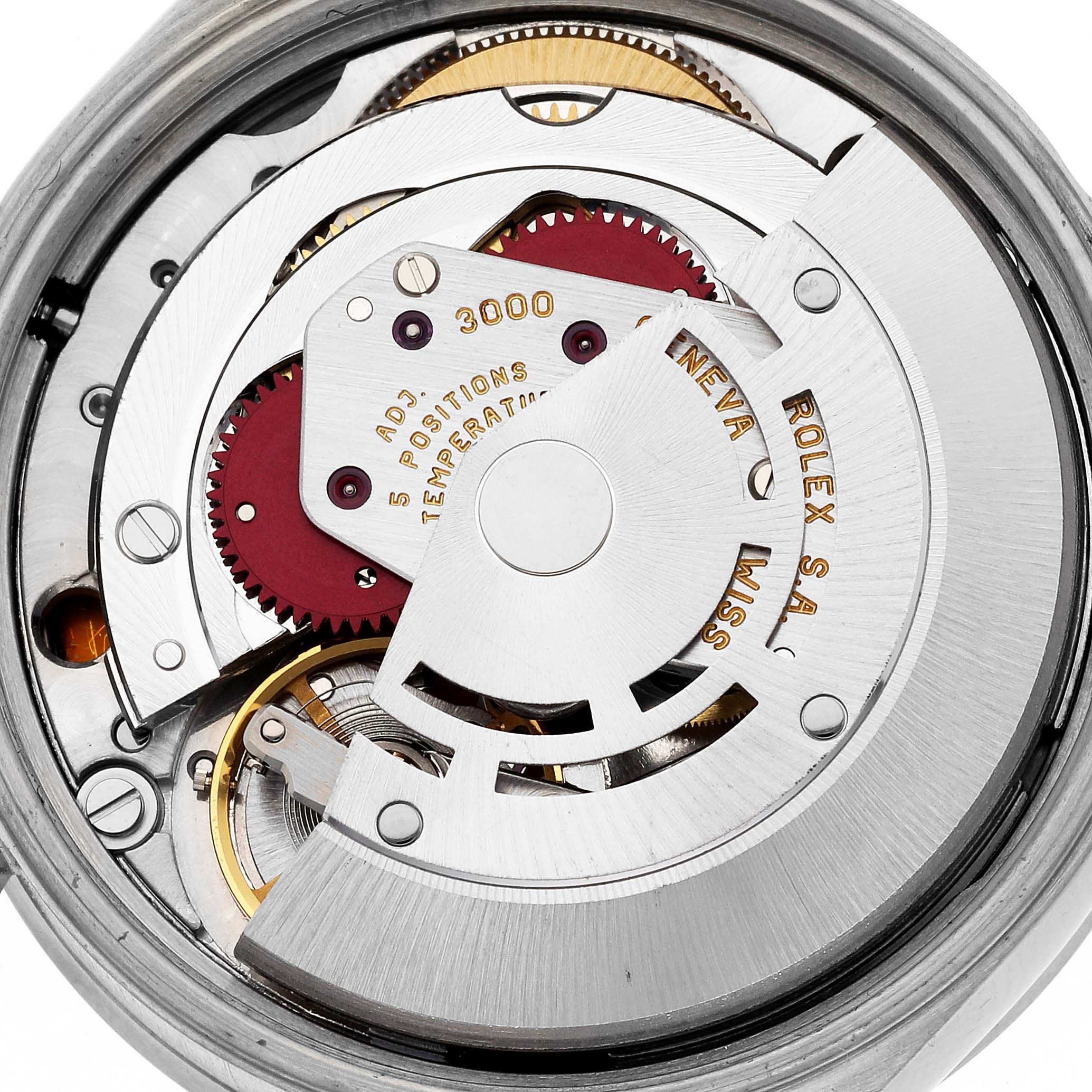 This close-up image shows the inner movement mechanism of a Rolex Air-King 14010 Men's Stainless Steel Blue Dial 14010 Men's Stainless Steel Blue Dial watch, highlighting gears and the rotor.