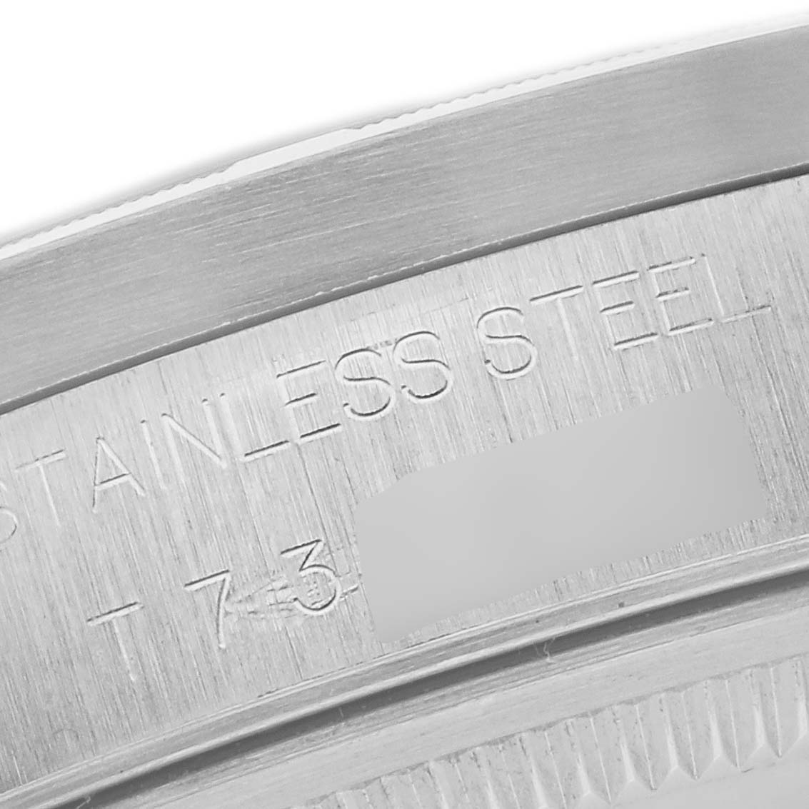 This image shows a close-up of the stainless steel case back with the model details of the Rolex Air-King 14010 Men's Stainless Steel Blue Dial 14010 Men's Stainless Steel Blue Dial watch.