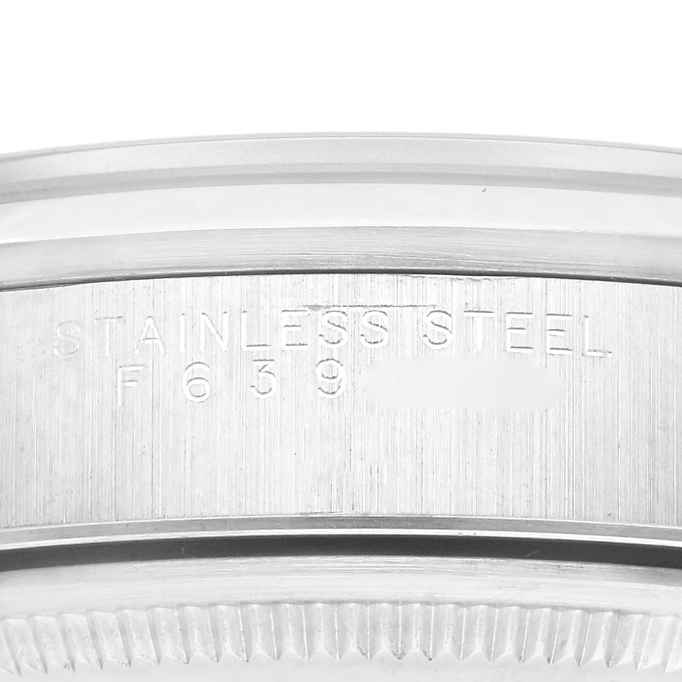This image shows a close-up of the stainless steel case back of a Rolex Air-King 14000 Men's Stainless Steel Silver Dial 14000 Men's Stainless Steel Silver Dial watch, highlighting the engraved text.