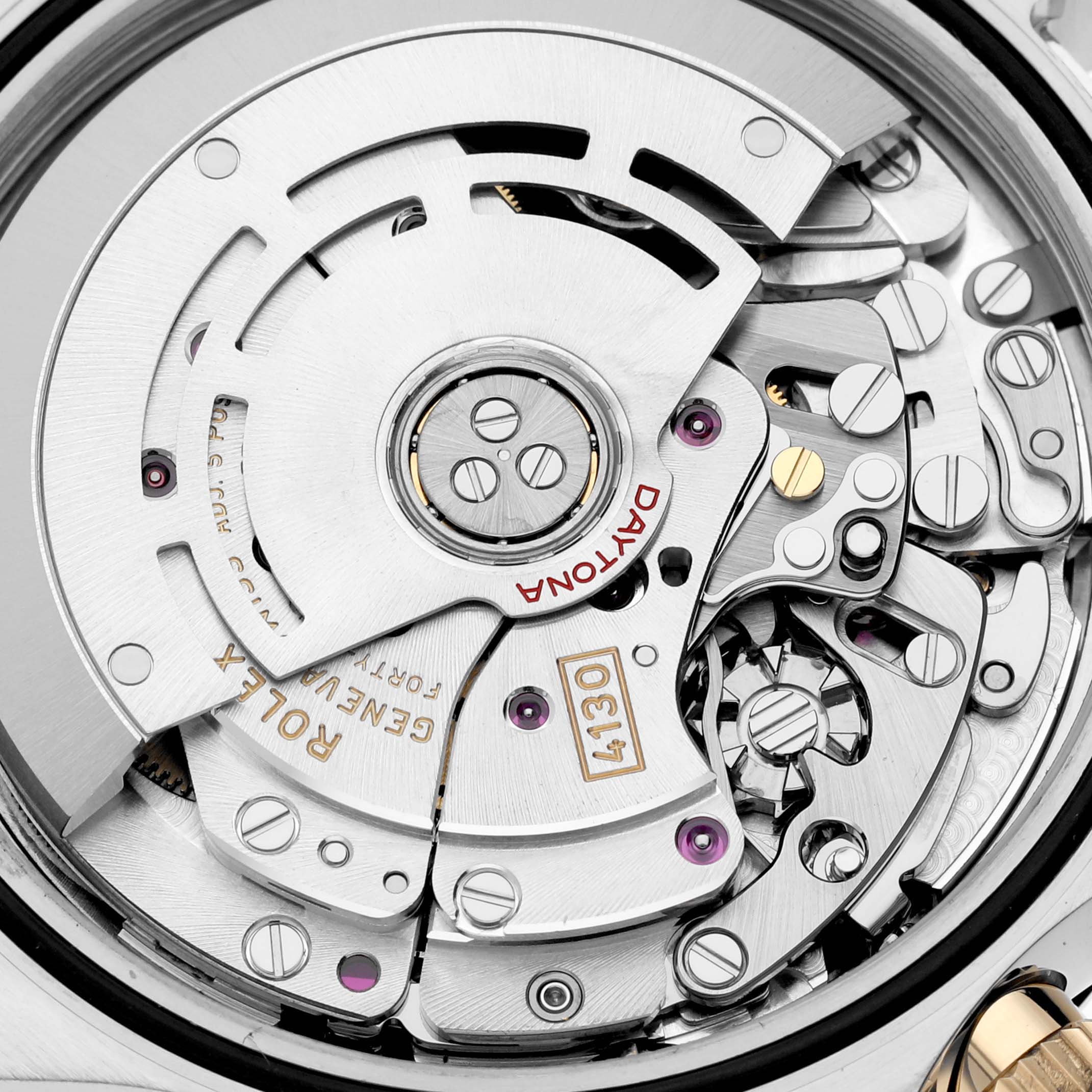 The image displays the intricate internal mechanism of the Rolex Daytona 116503 Men
s Steel and Gold (two tone) Black Dial 116503 Men
s Steel and Gold (two tone) Black Dial watch, showcasing its movement and components.