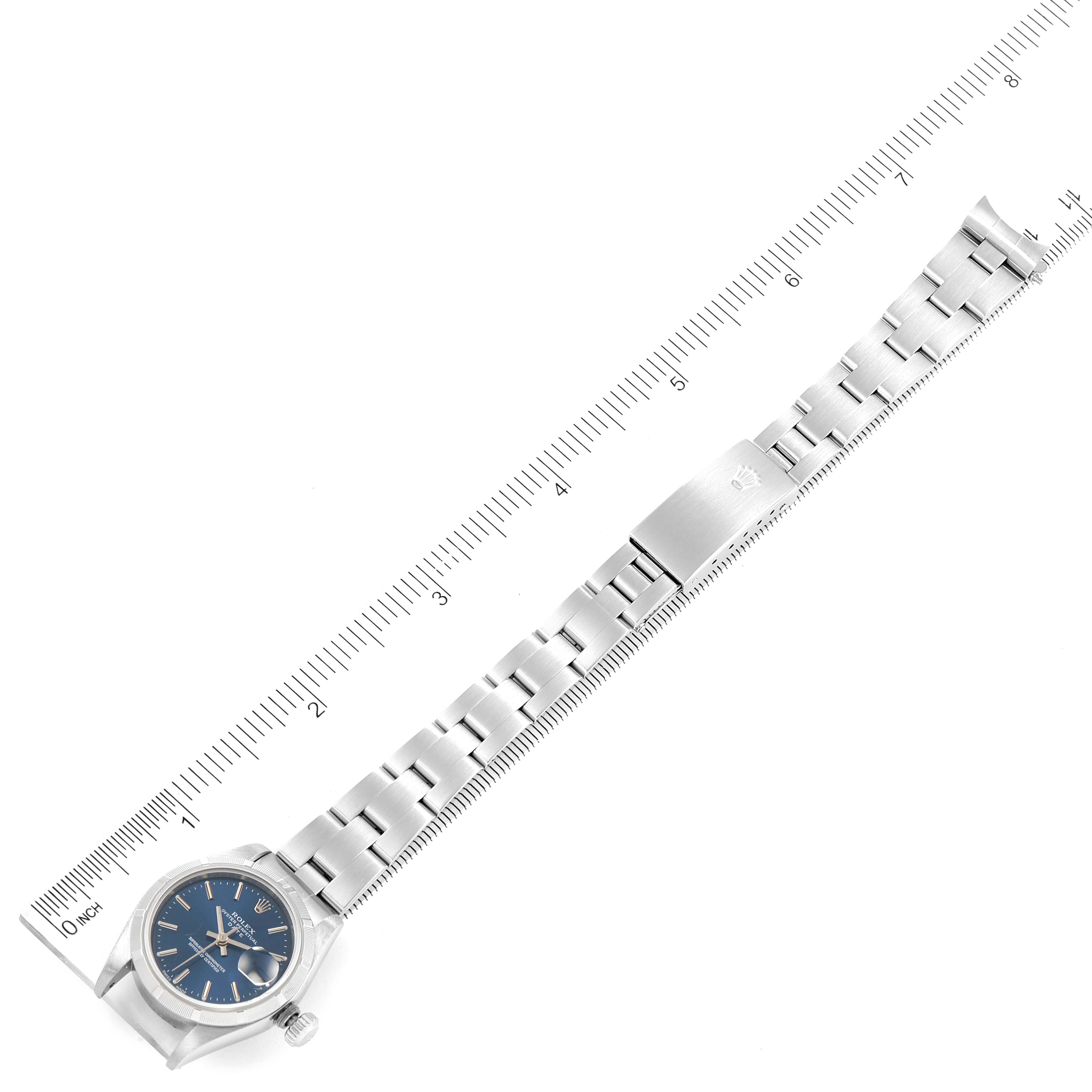 This image shows a Rolex Date 79190 Women's Stainless Steel Blue Dial 79190 Women's Stainless Steel Blue Dial watch laid flat with its bracelet extended, measured by a ruler.
