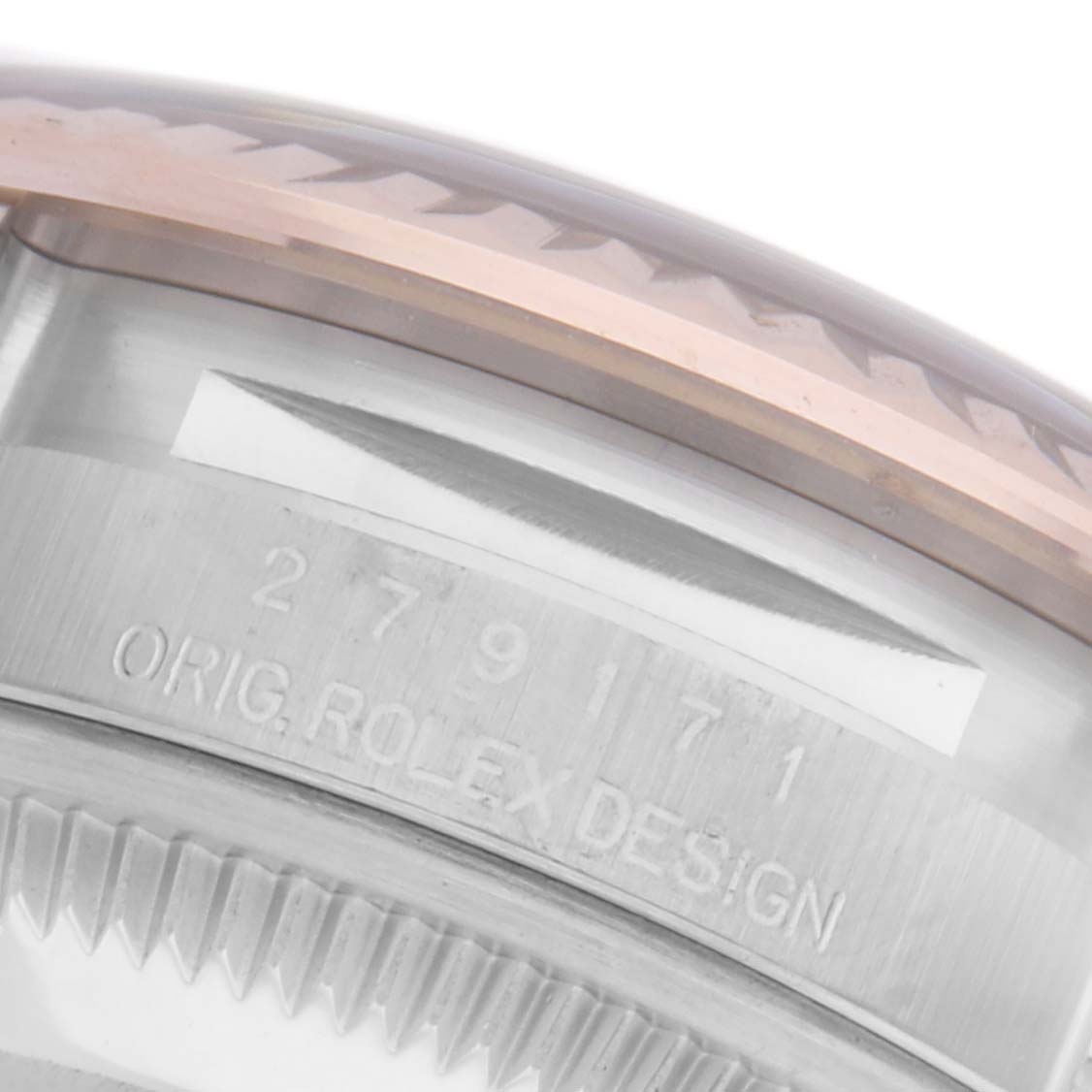 The image shows a close-up of the Rolex Datejust 279171 Women's Steel and Gold (two tone) Pink Dial 279171 Women's Steel and Gold (two tone) Pink Dial model's side, highlighting the case edge and part of the bezel.