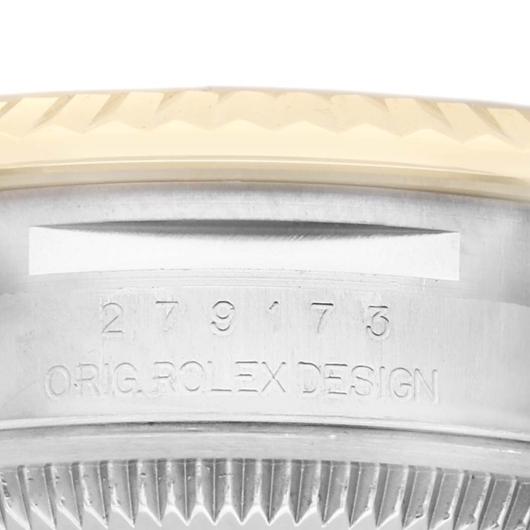 The image shows a close-up of the Rolex Datejust 279173 Women's Steel and Gold (two tone) Champagne Dial 279173 Women's Steel and Gold (two tone) Champagne Dial's case side, revealing its serial number and design engraving.