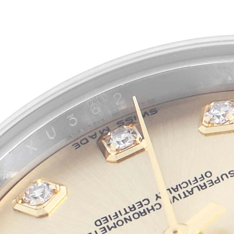 The image shows a close-up of the Rolex Datejust 279173 Women's Steel and Gold (two tone) Champagne Dial 279173 Women's Steel and Gold (two tone) Champagne Dial watch, highlighting the dial, diamond hour markers, and part of the bezel.