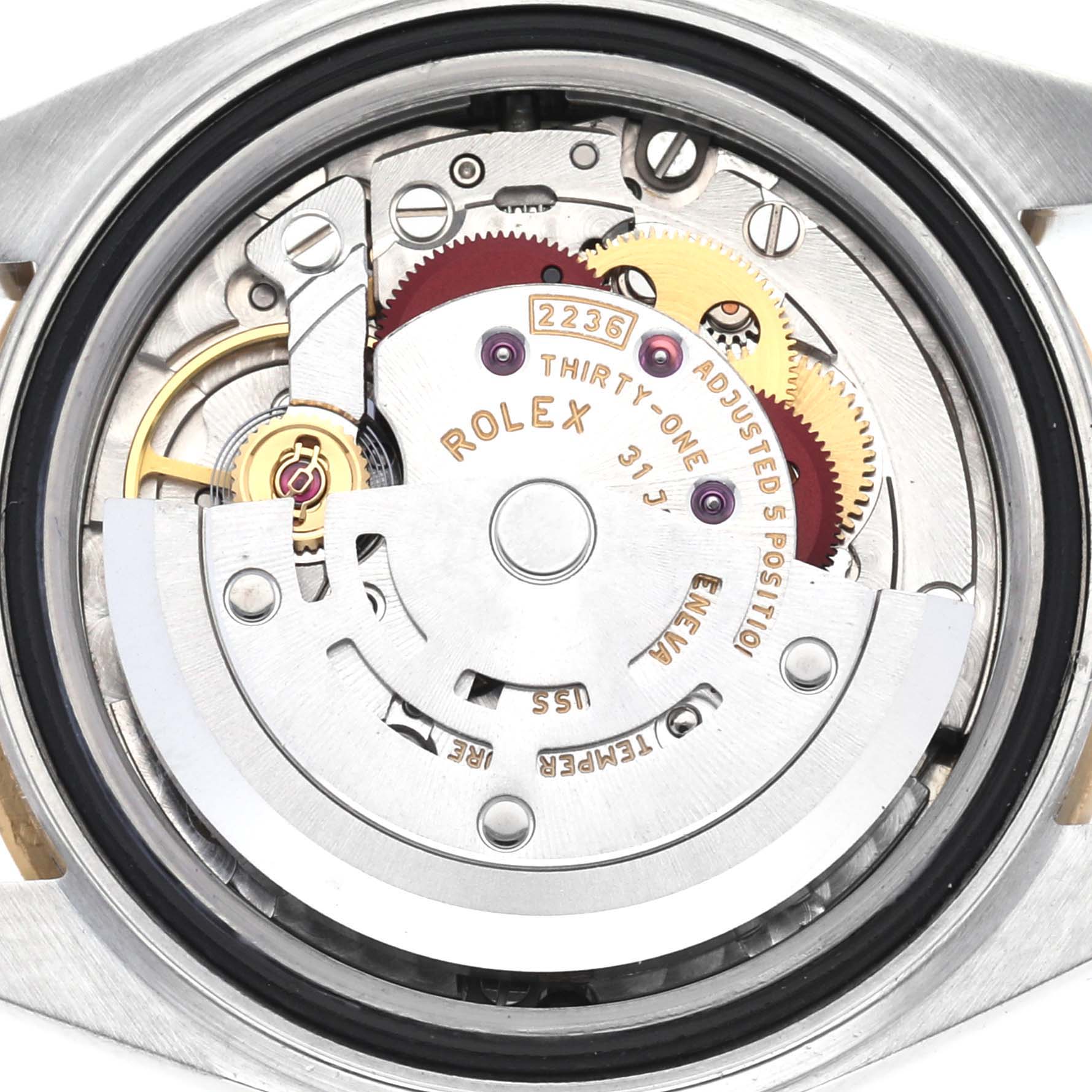 The image shows the movement of a Rolex Datejust 279173 Women's Steel and Gold (two tone) Champagne Dial 279173 Women's Steel and Gold (two tone) Champagne Dial, highlighting gears and inscriptions inside the watch case.