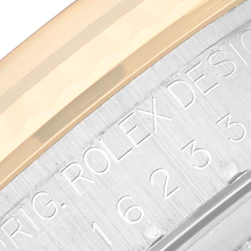 This close-up image shows the engraved part of the casing of a Rolex Datejust 16233 Men's Stainless Steel Black Dial 16233 Men's Stainless Steel Black Dial watch.
