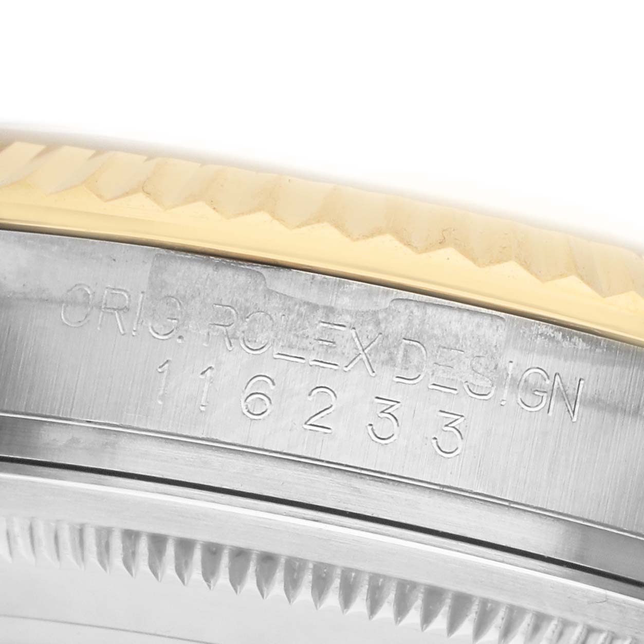 The image shows a close-up of the Rolex Datejust 116233 Men's Steel and Gold (two tone) Champagne Dial model's engraved case edge, highlighting the model number.