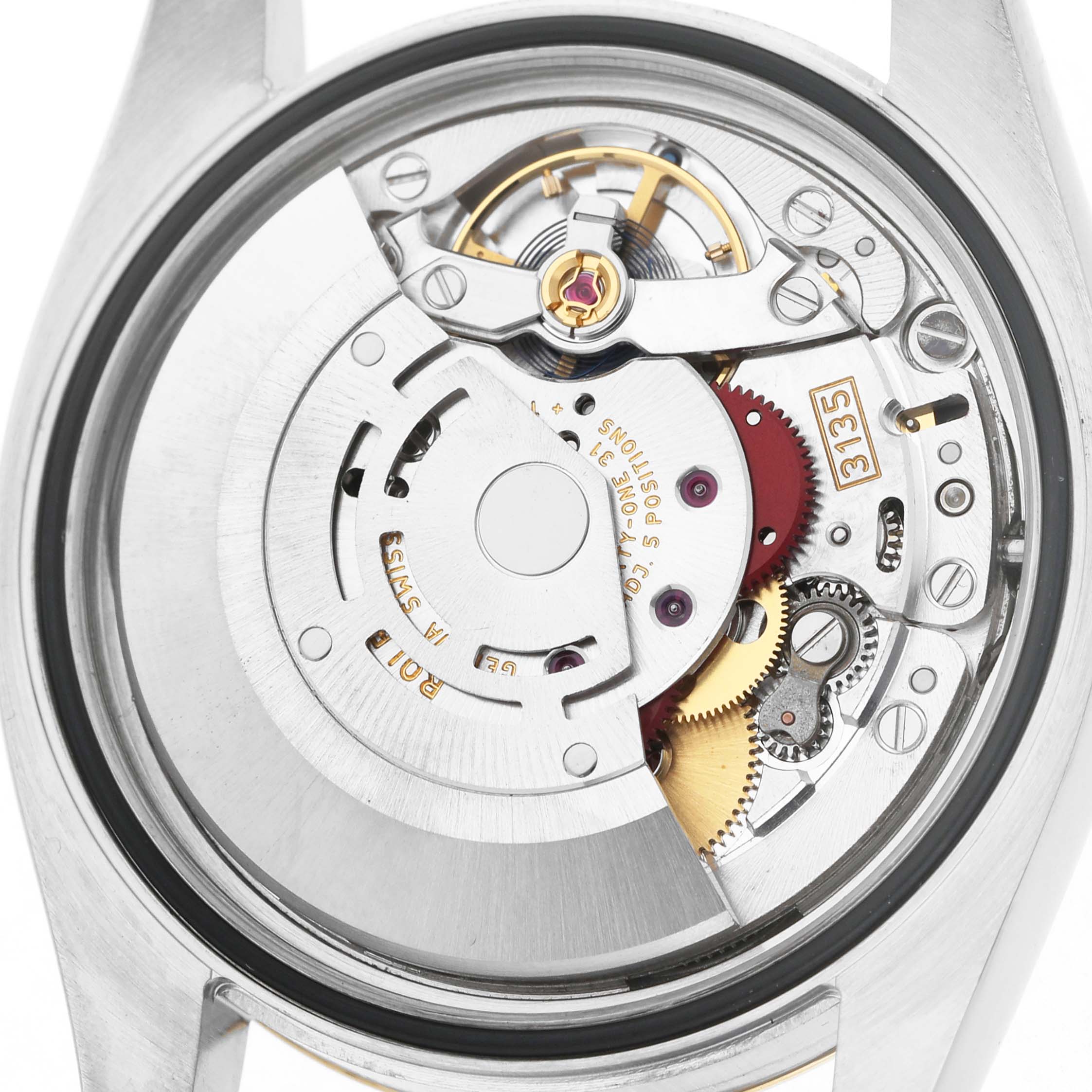 The image shows the movement from the back of the Rolex Datejust 116233 Men's Steel and Gold (two tone) Champagne Dial watch, highlighting gears and components.