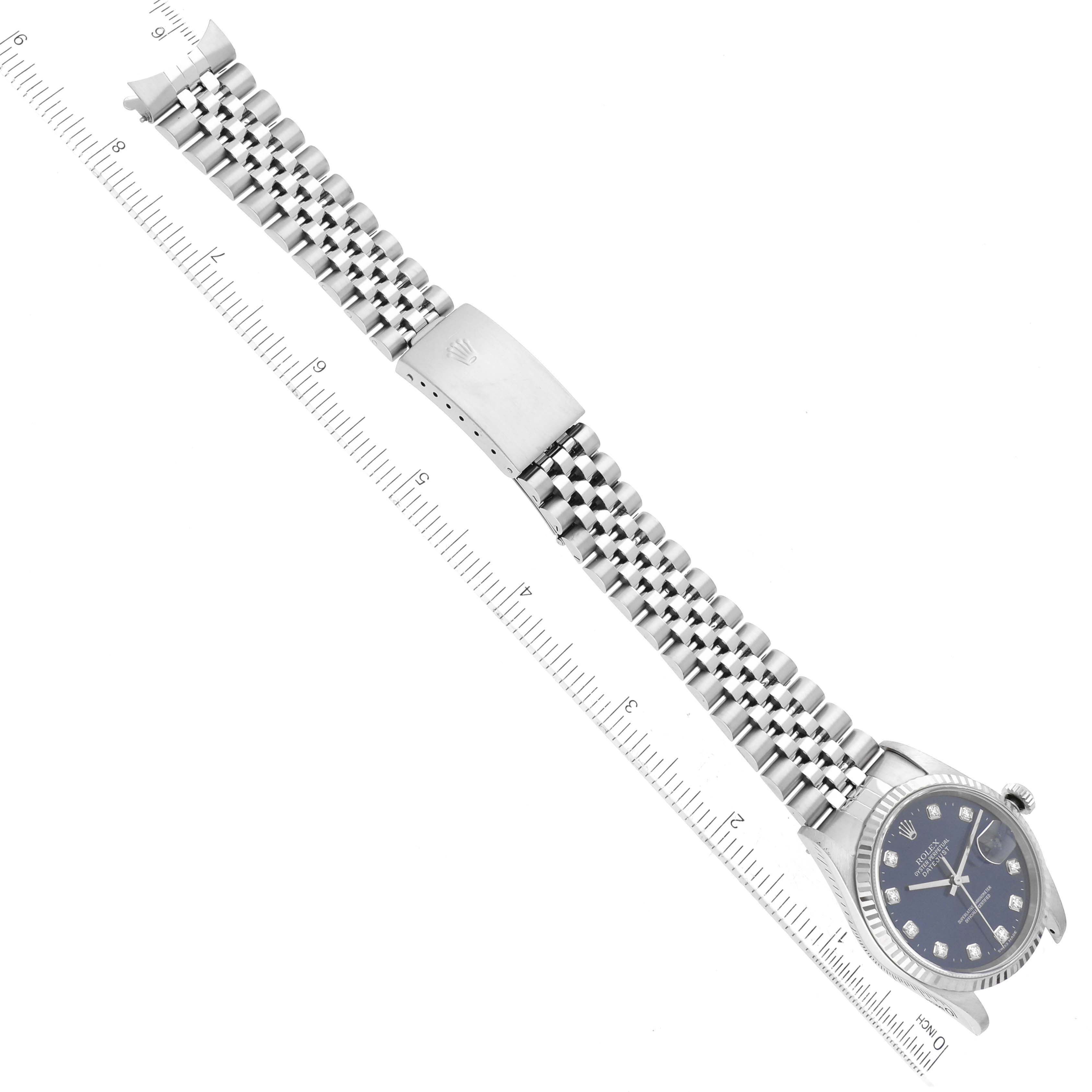 The image shows a Rolex Datejust 16234 Men's Stainless Steel Blue Dial 16234 Men's Stainless Steel Blue Dial watch laid flat with the bracelet extended and a ruler beneath it for measurement.