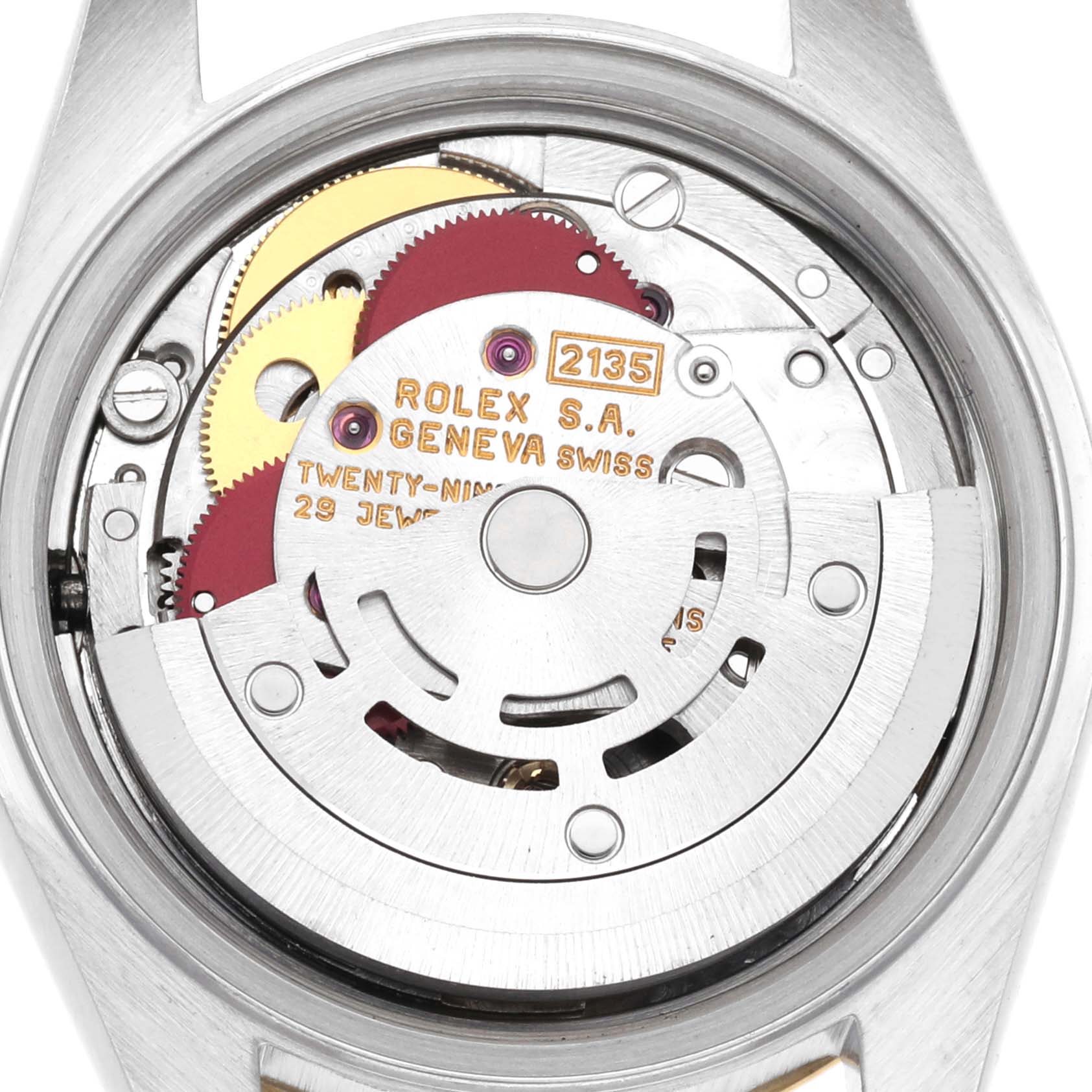 The image shows the internal movement mechanism of a Rolex Datejust 69173 Women's Steel and Gold (two tone) Champagne Dial 69173 Women's Steel and Gold (two tone) Champagne Dial watch from the back, featuring gears and the engraved rotor.