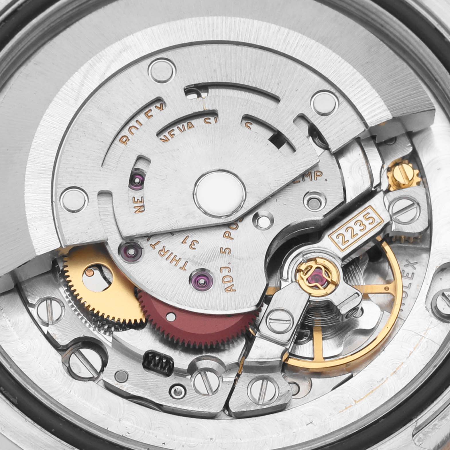 The image shows a close-up, top-down view of the internal movement mechanism of a Rolex Mid-Size 178341 Women's Steel and Gold (two tone) Pink Dial 178341 Women's Steel and Gold (two tone) Pink Dial model, displaying gears and components.