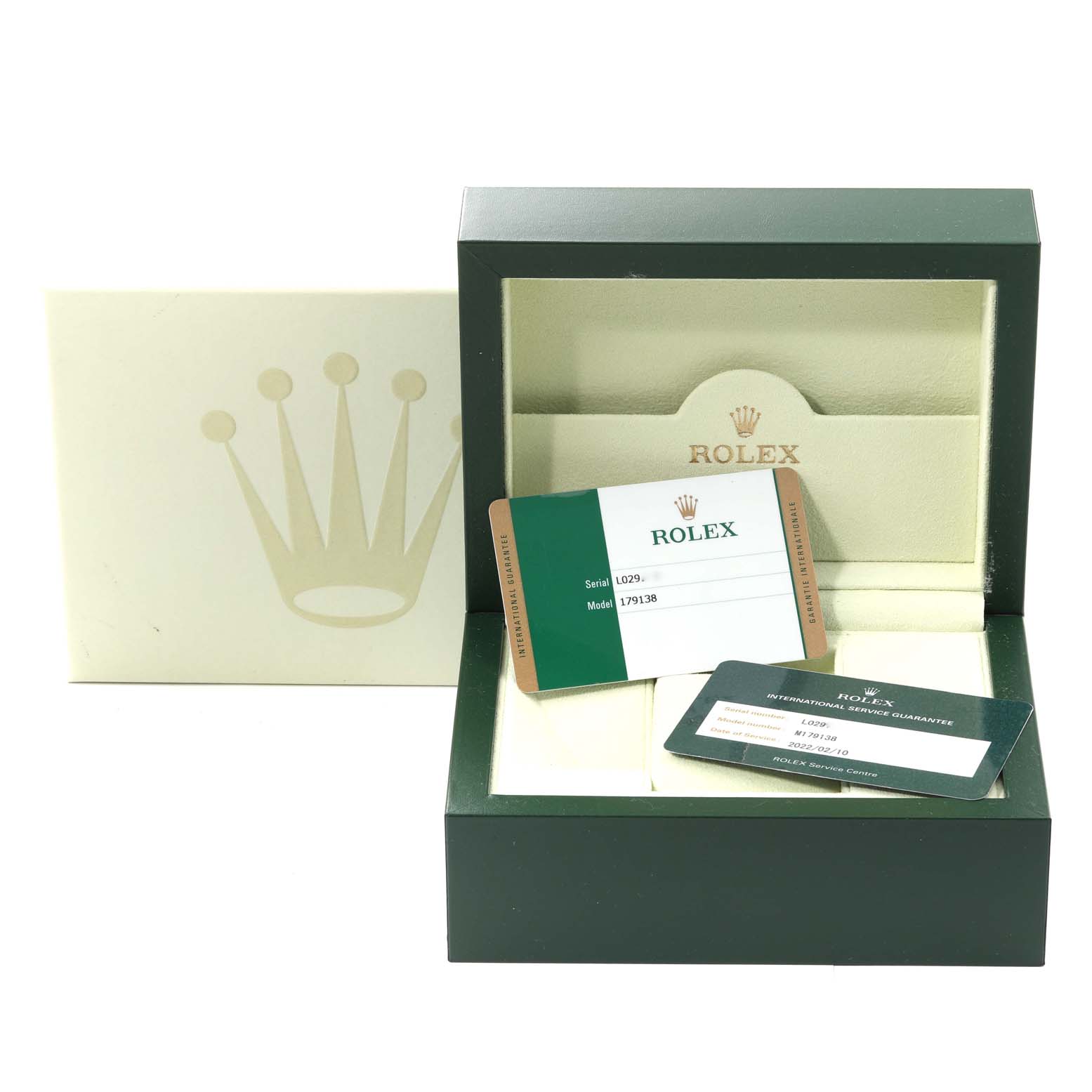This image shows the packaging and warranty cards for the Rolex President 179138 Women's Yellow Gold Black Dial 179138 Women's Yellow Gold Black Dial model, highlighting the box and documentation.