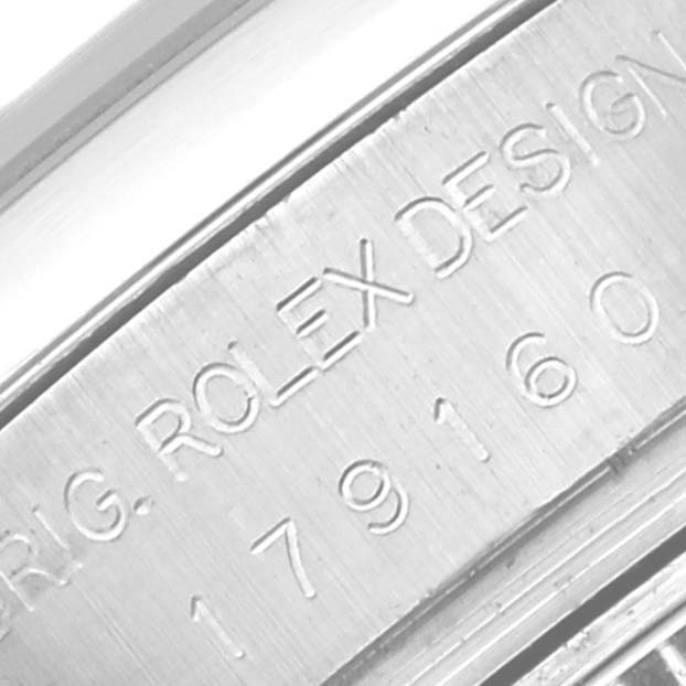 The image shows a close-up of the watch case with the serial number and "ROLEX DESIGN" engraving for the Rolex Datejust 179160 Women's Stainless Steel Pink Dial 179160 Women's Stainless Steel Pink Dial model.