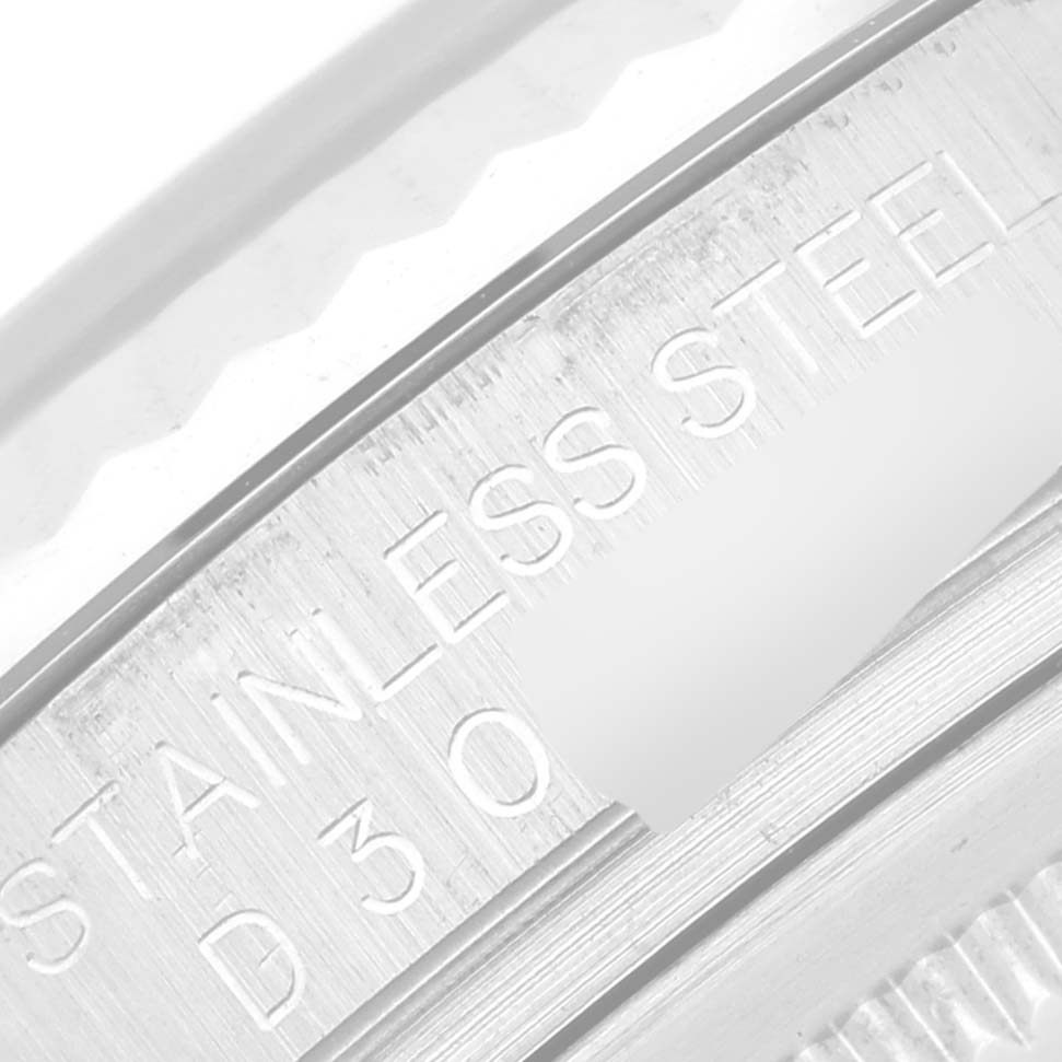 This close-up image shows the stainless steel engraving on the inner bezel of a Rolex Datejust 116234 Men's Stainless Steel Black Dial 116234 Men's Stainless Steel Black Dial watch.