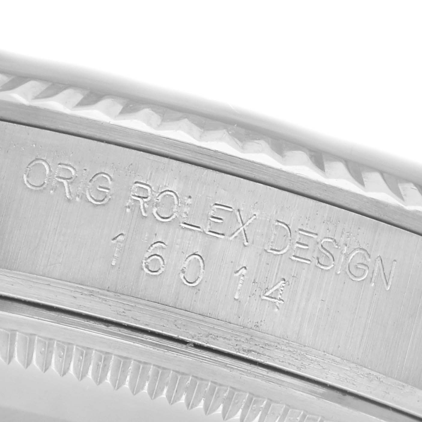 The image shows a close-up of the case edge of a Rolex Datejust 16014 Men's Stainless Steel Silver Dial 16014 Men's Stainless Steel Silver Dial, focusing on the engraved reference number and design details.