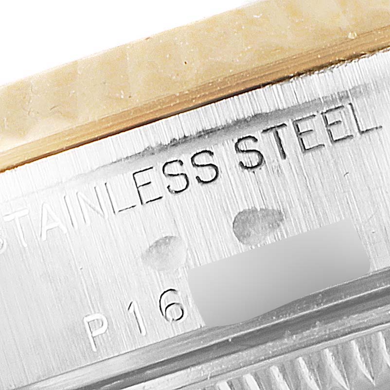 This close-up image shows the stainless steel marking on a Rolex Datejust 79173 Women's Steel and Gold (two tone) Blue Dial 79173 Women's Steel and Gold (two tone) Blue Dial watch case.