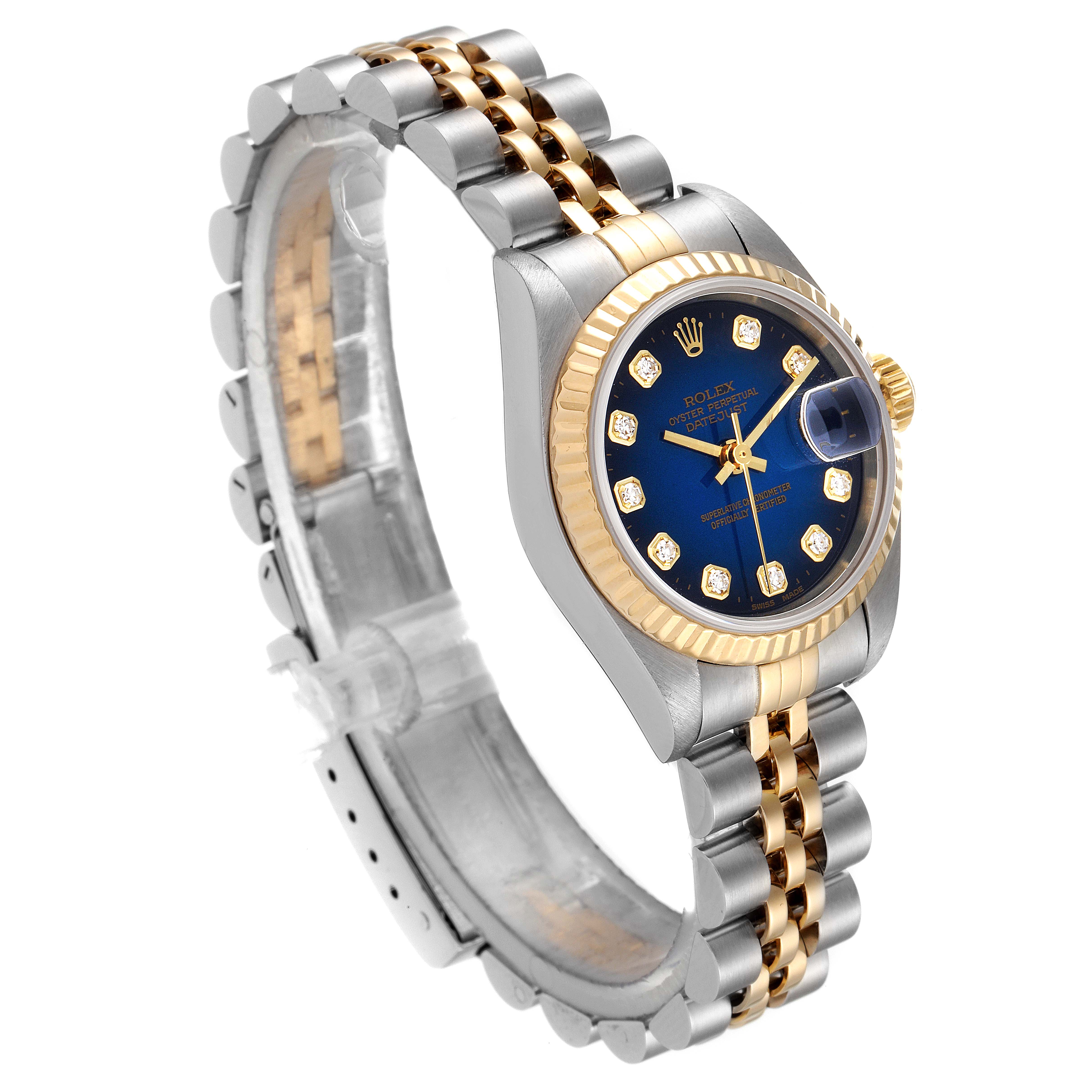 The Rolex Datejust 79173 Women's Steel and Gold (two tone) Blue Dial 79173 Women's Steel and Gold (two tone) Blue Dial watch is shown at a slight angle, highlighting the blue dial, gold fluted bezel, and two-tone bracelet.