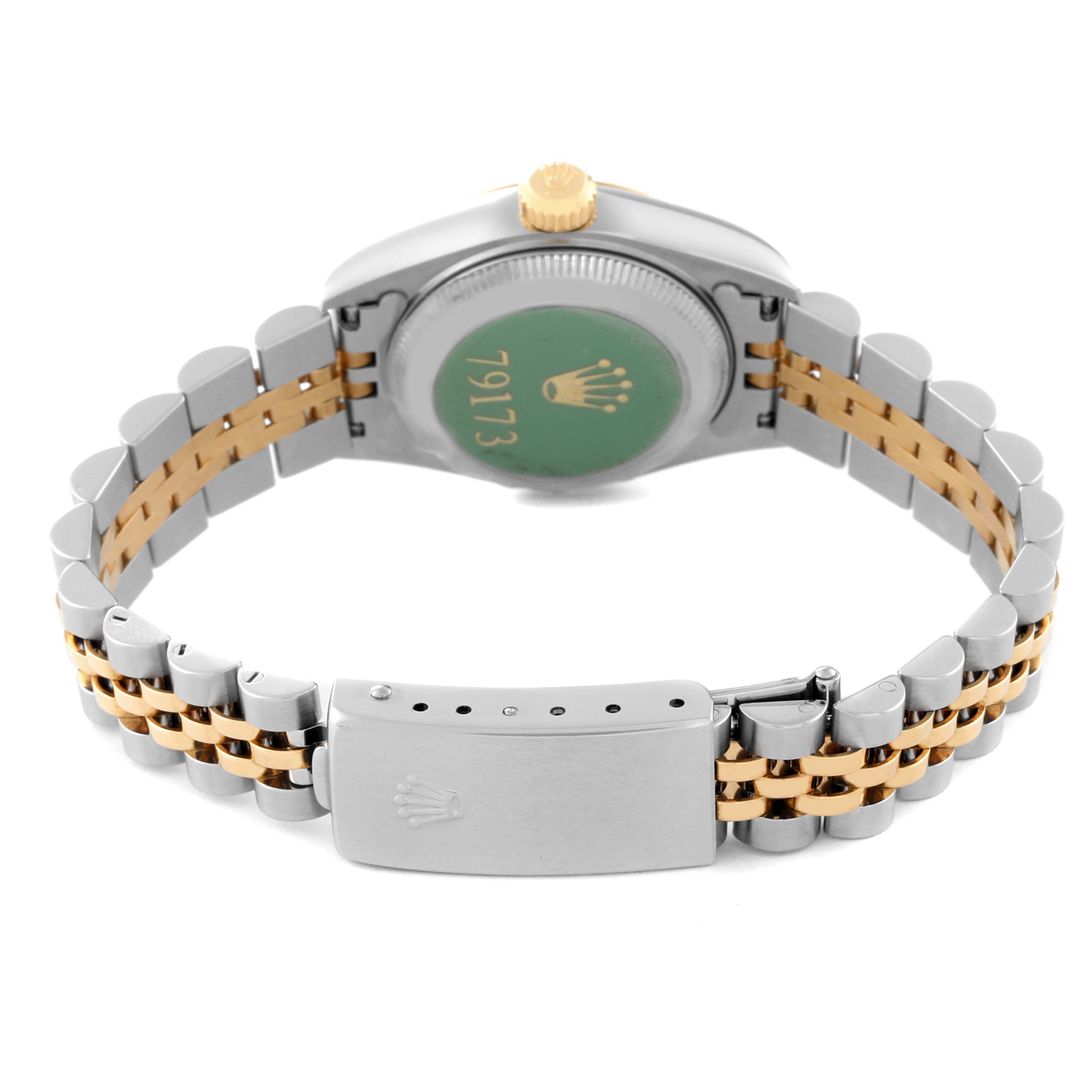The image shows the back case and bracelet of the Rolex Datejust 79173 Women's Steel and Gold (two tone) Champagne Dial 79173 Women's Steel and Gold (two tone) Champagne Dial watch, highlighting its two-tone metal design and clasp.