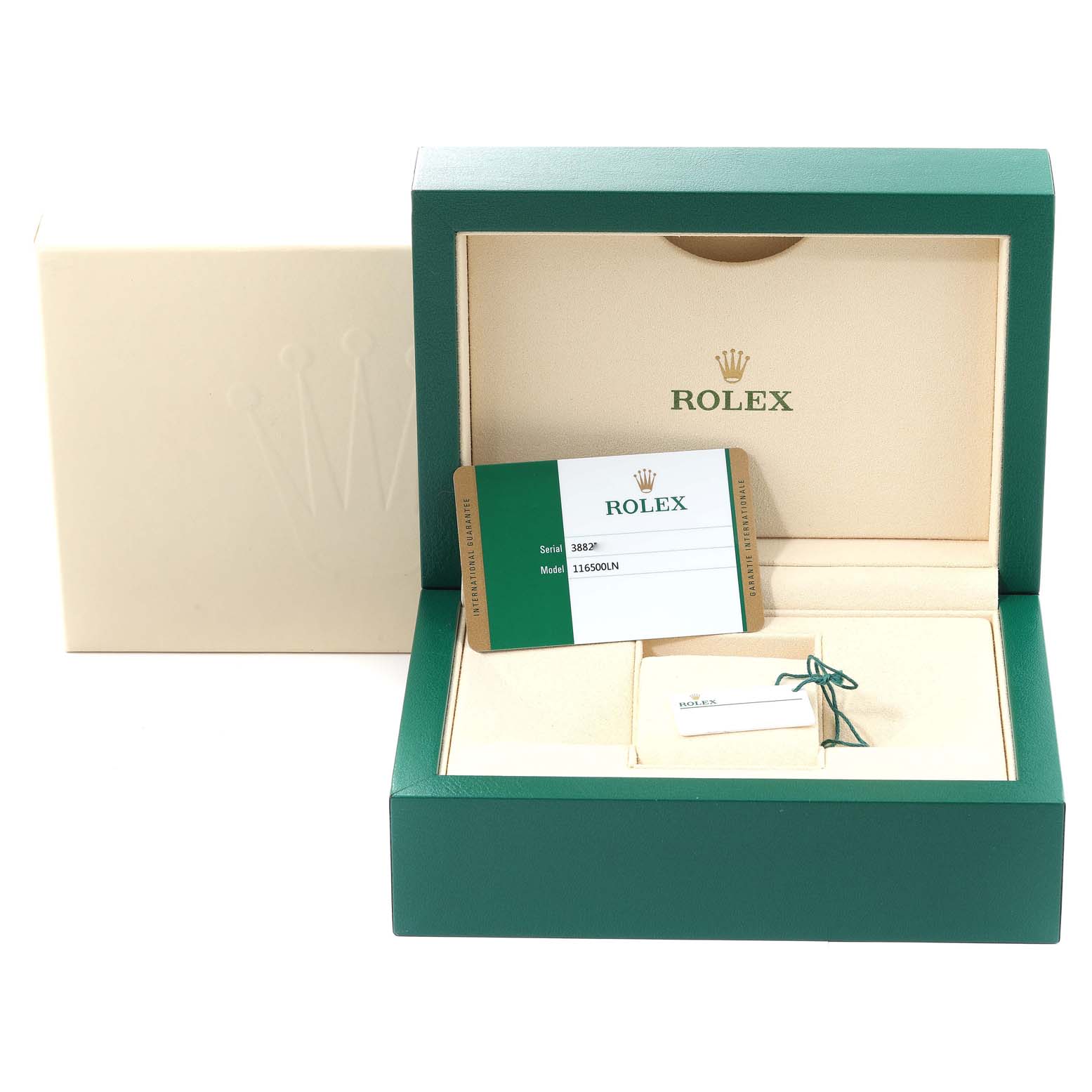 The image shows the packaging, warranty card, and accessory tag of a Rolex Daytona 116500 Men's Stainless Steel Black Dial 116500 Men's Stainless Steel Black Dial watch from a frontal angle.