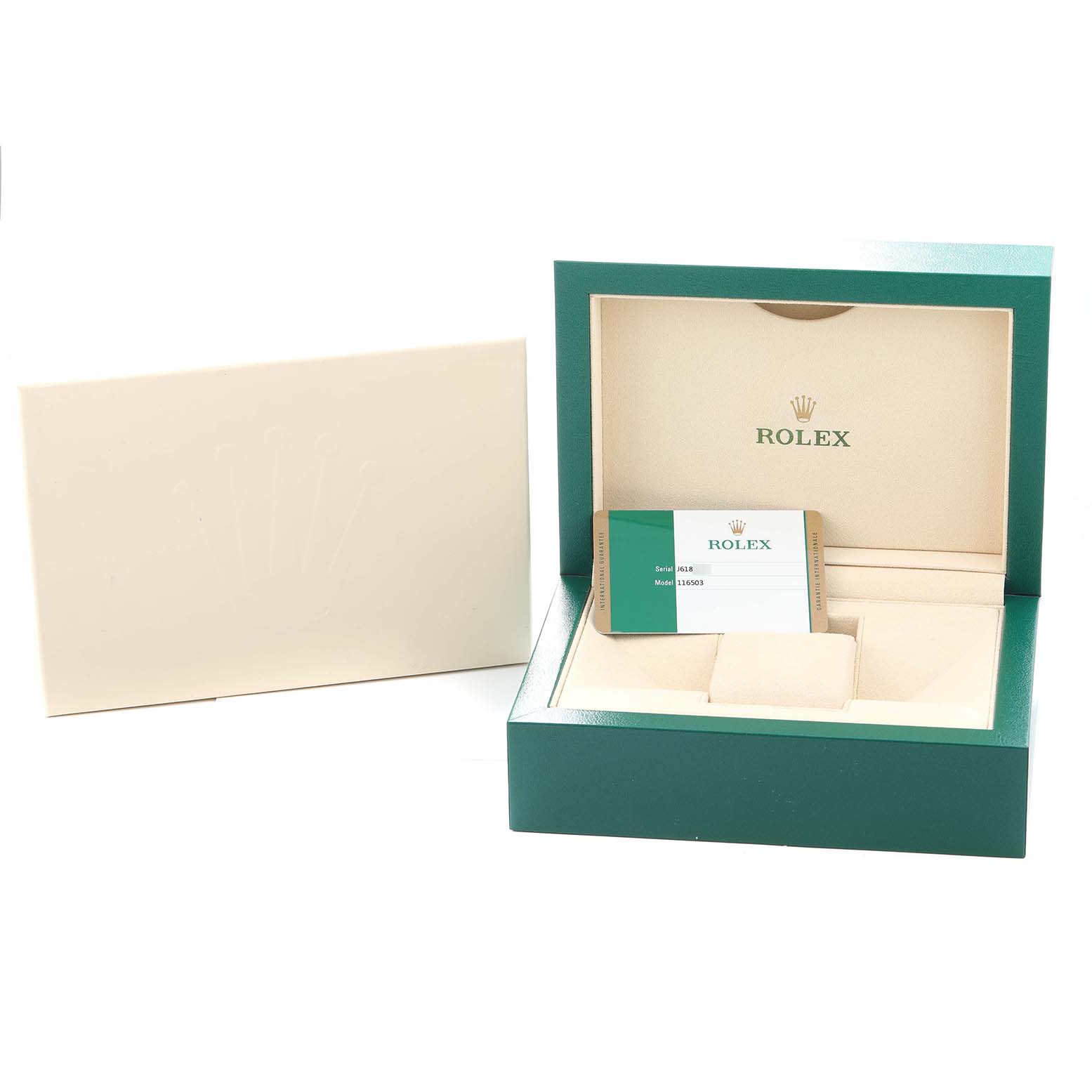 The image shows an open Rolex box for a Daytona model with a warranty card and cream-colored interior.