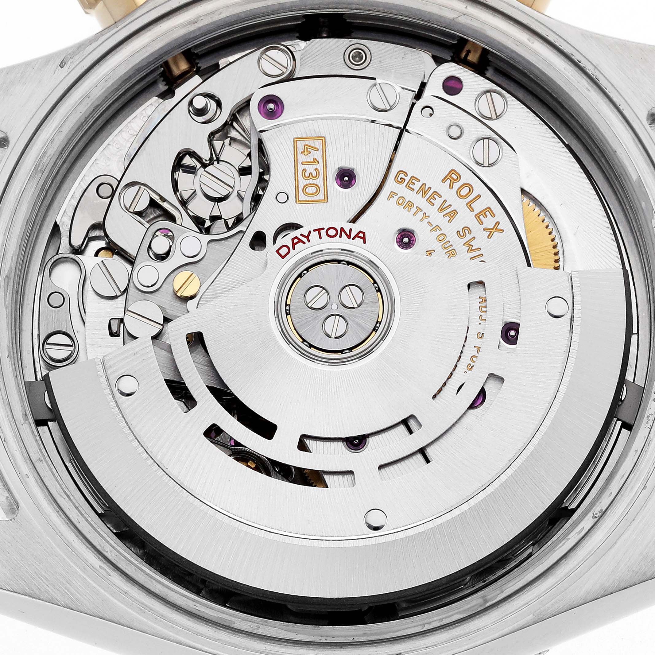 The image shows the movement of a Rolex Daytona 116503 Men's Steel and Gold (two tone) Mother of Pearl Dial watch from a rear angle, highlighting its intricate mechanical parts.