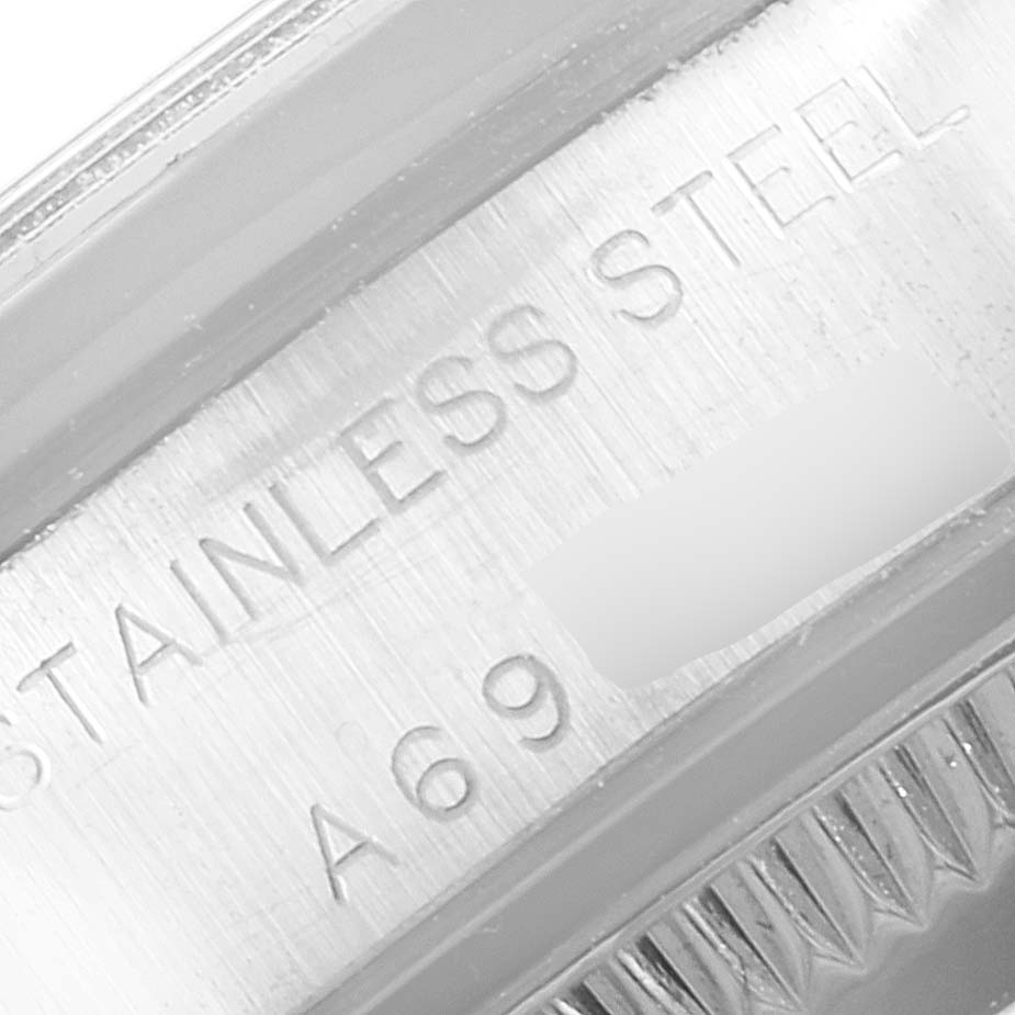This close-up image shows the stainless steel marking on the caseback of a Rolex Oyster Perpetual 76080 Women's Stainless Steel White Dial 76080 Women's Stainless Steel White Dial watch.