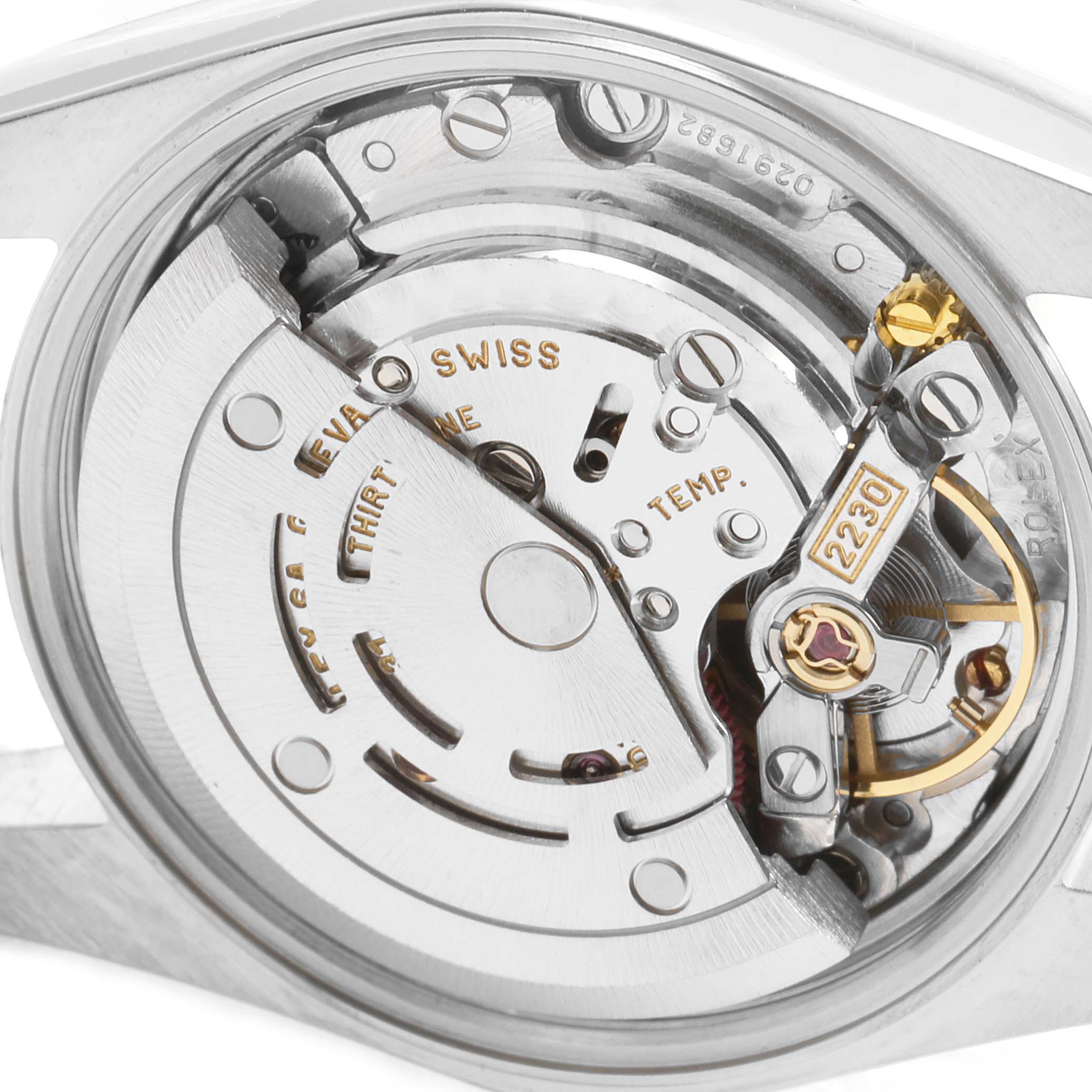 This close-up shows the internal movement mechanism of a Rolex Oyster Perpetual 76080 Women's Stainless Steel White Dial 76080 Women's Stainless Steel White Dial watch model.