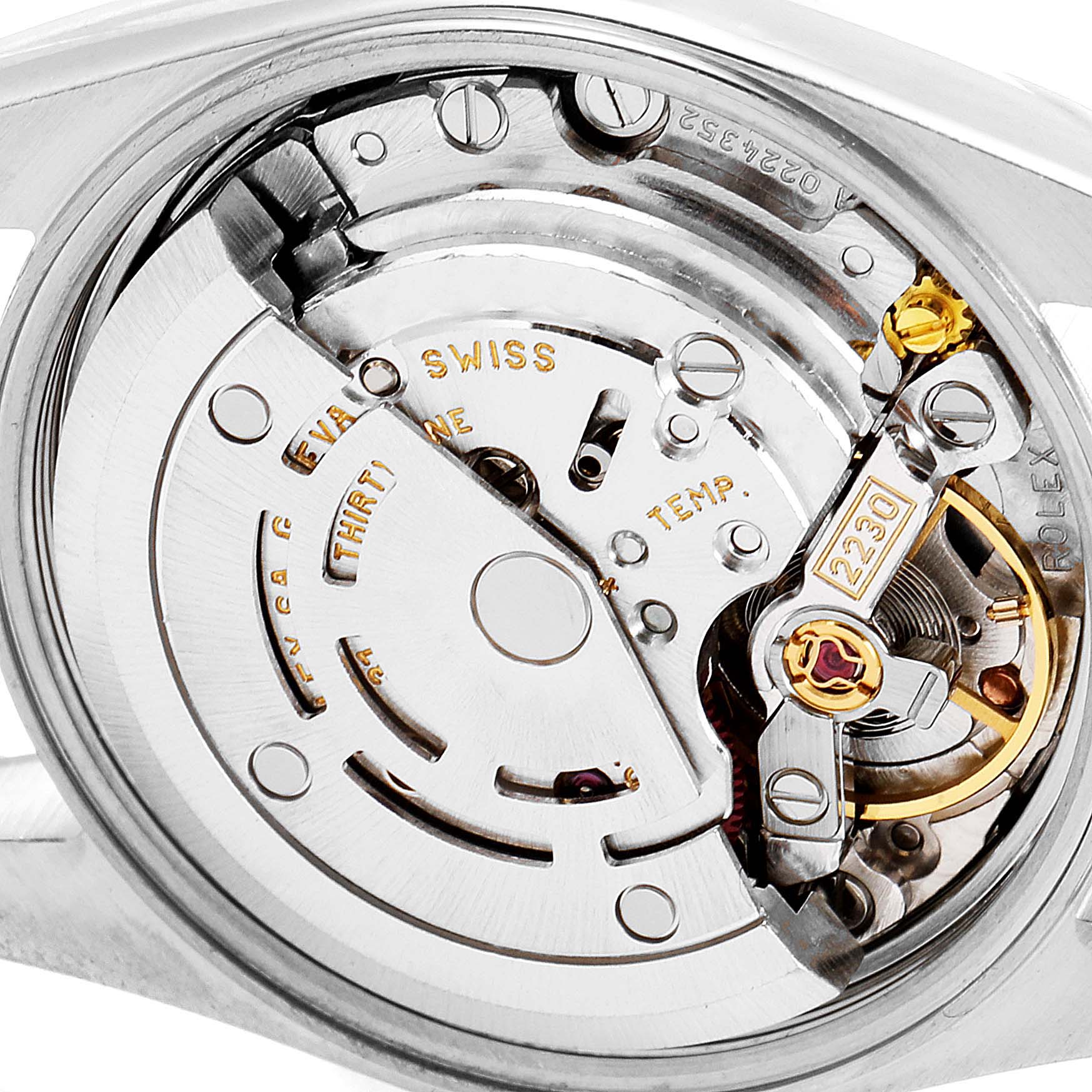 The image shows a close-up of the movement mechanism of an Oyster Perpetual Rolex watch.