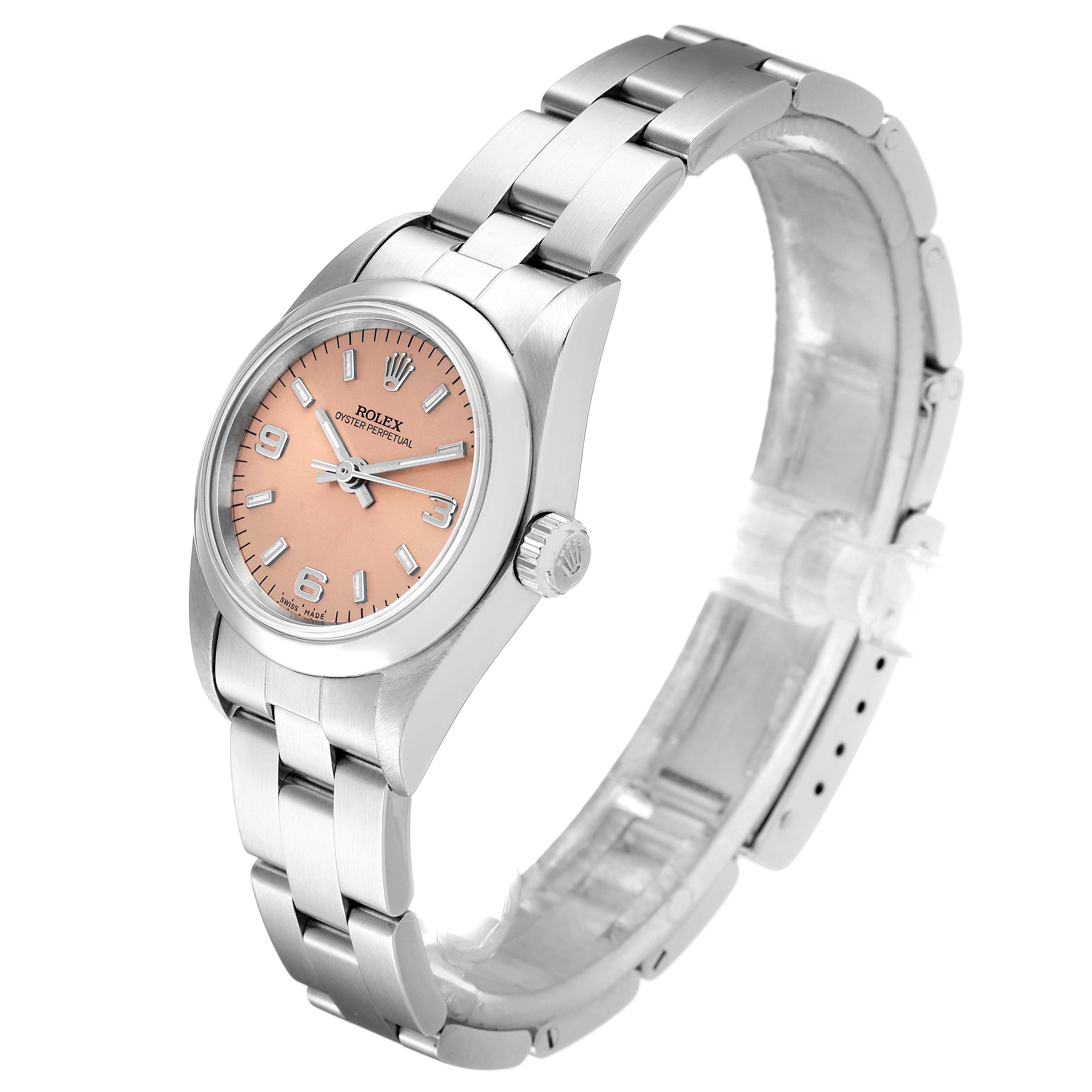 The Rolex Oyster Perpetual 76080 Women's Stainless Steel Pink Dial 76080 Women's Stainless Steel Pink Dial watch is shown at a slight angle, displaying its pink dial, case, crown, and bracelet.