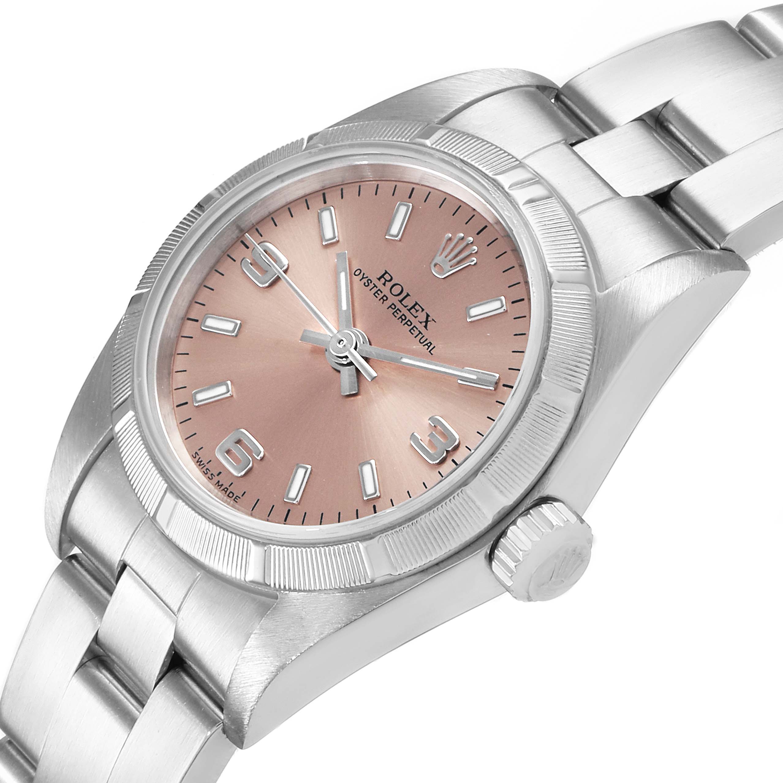 The image shows a close-angle view of the Rolex Oyster Perpetual 76030 Women's Stainless Steel Pink Dial 76030 Women's Stainless Steel Pink Dial watch, highlighting the dial, bezel, and bracelet.