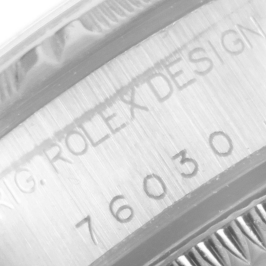 This close-up image shows the engraved inner bezel of a Rolex Oyster Perpetual 76030 Women's Stainless Steel Pink Dial 76030 Women's Stainless Steel Pink Dial watch design with the model number "76030."