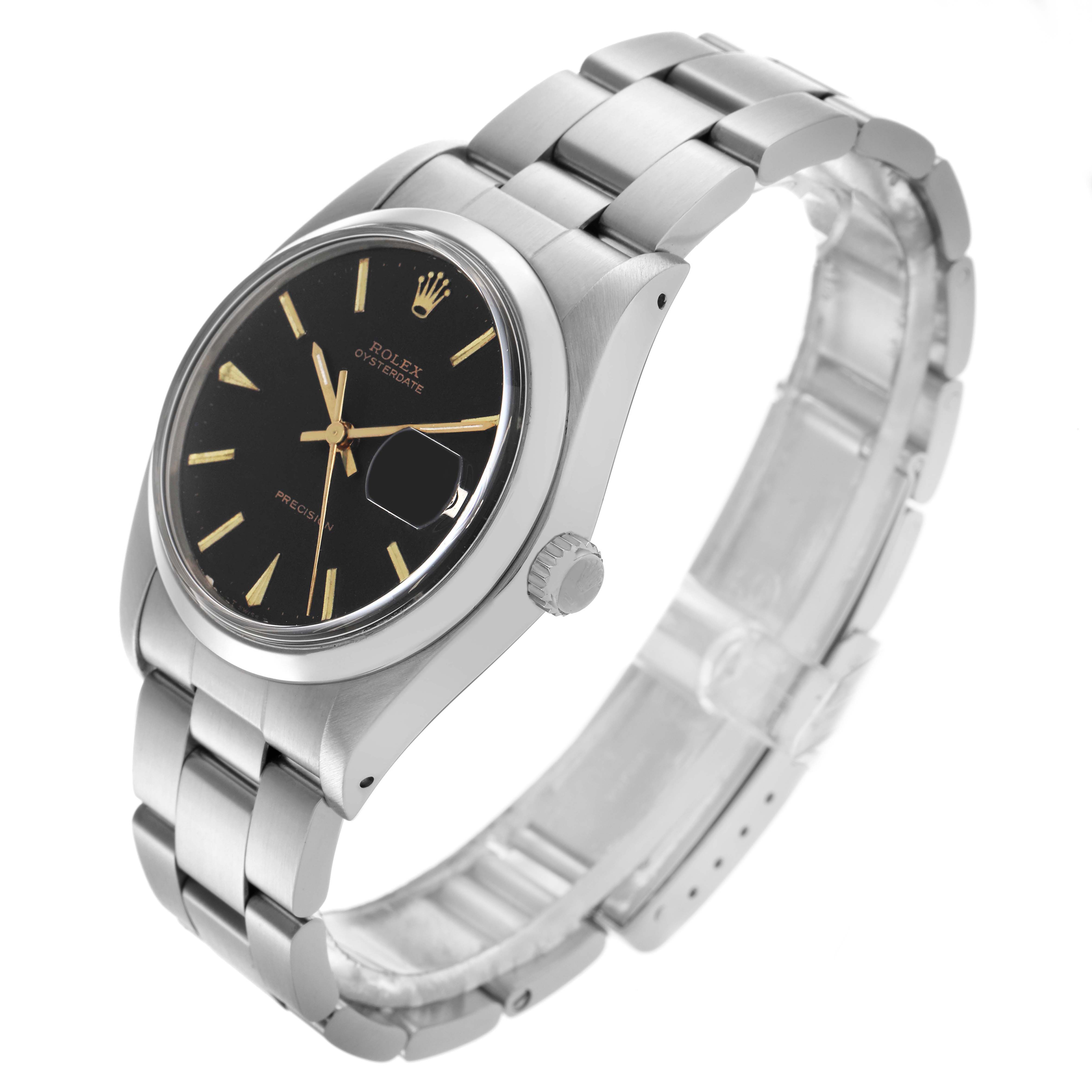 The Rolex Date watch is shown at an oblique angle, highlighting the black dial, crown, bracelet, and cyclops lens.