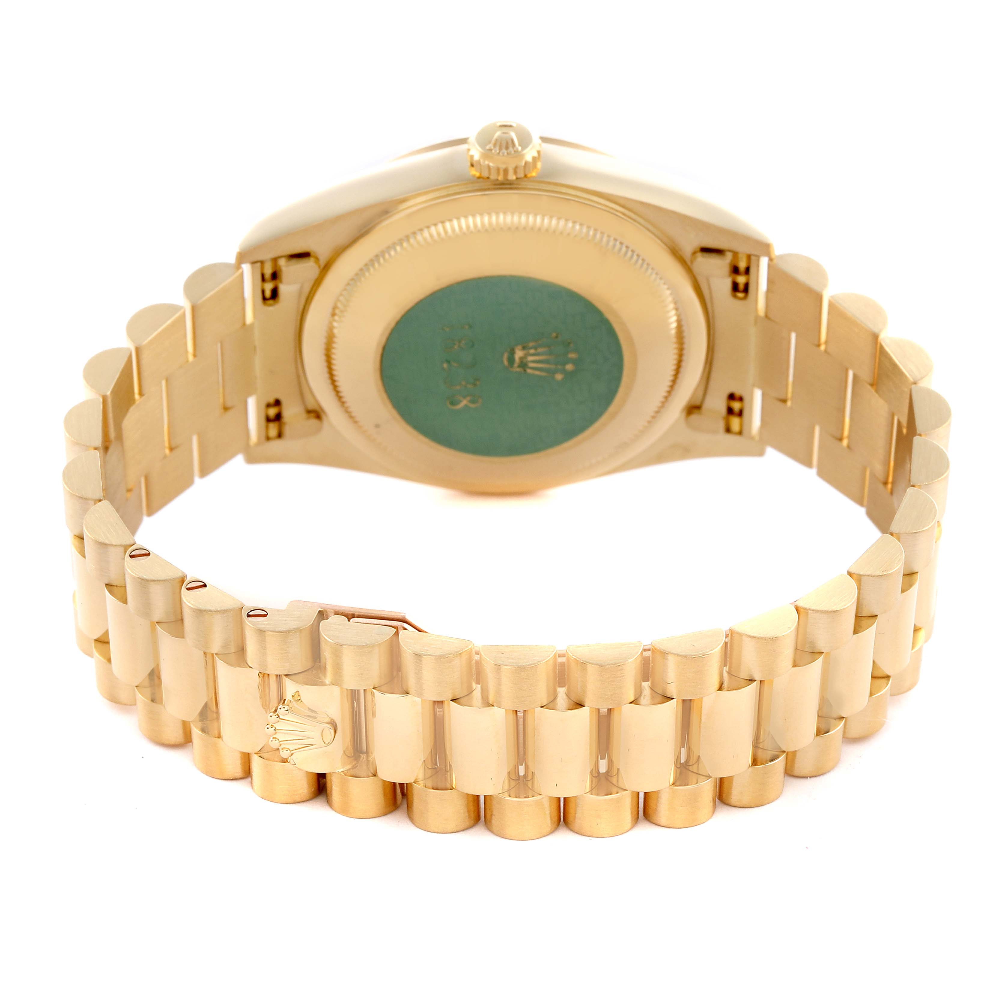 The image shows the back and bracelet of a Rolex President 18238 Men
s Yellow Gold Champagne Dial 18238 Men
s Yellow Gold Champagne Dial model watch, highlighting its gold links and emblem.