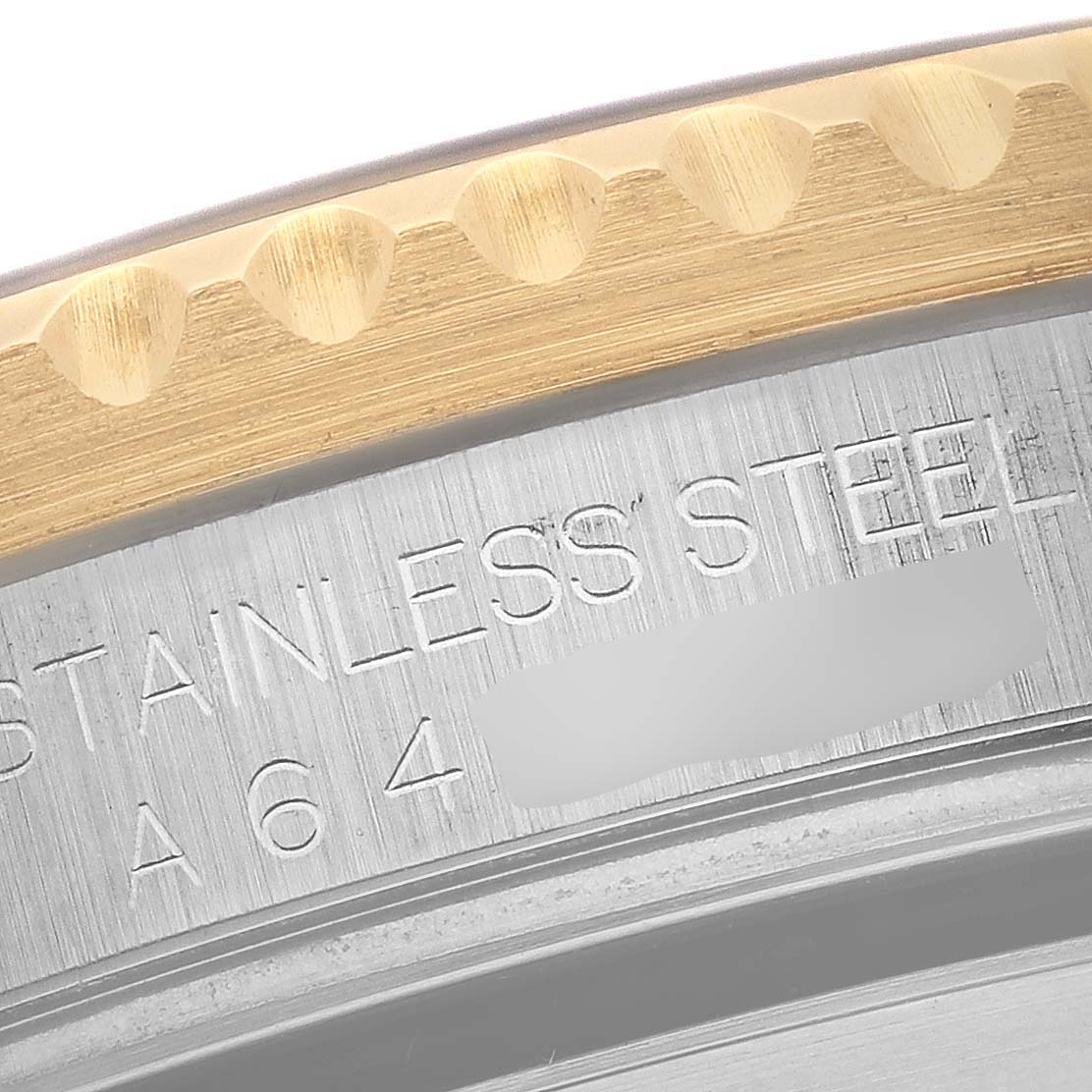 The image shows a close-up angle of the bezel and part of the stainless steel case of a Rolex Submariner 16613 Men's Steel and Gold (two tone) Blue Dial 16613 Men's Steel and Gold (two tone) Blue Dial watch.