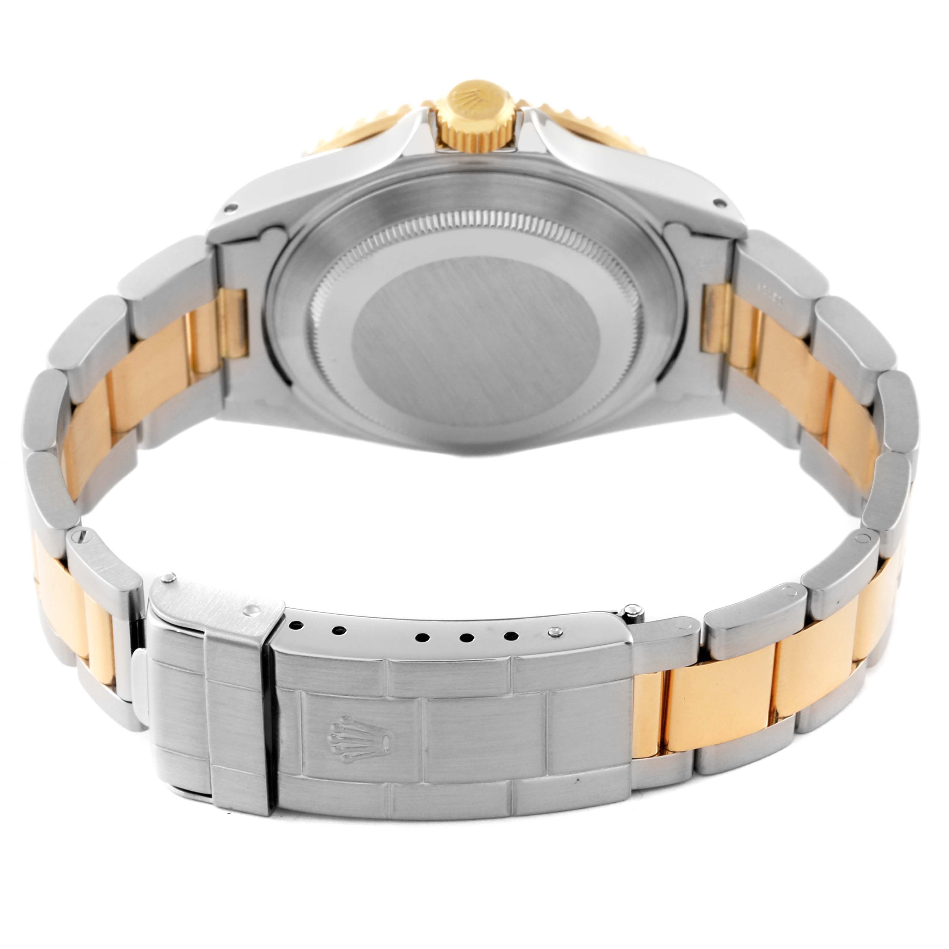 This image shows the back of a Rolex Submariner 16613 Men's Steel and Gold (two tone) Blue Dial 16613 Men's Steel and Gold (two tone) Blue Dial watch, highlighting its two-tone bracelet and clasp.