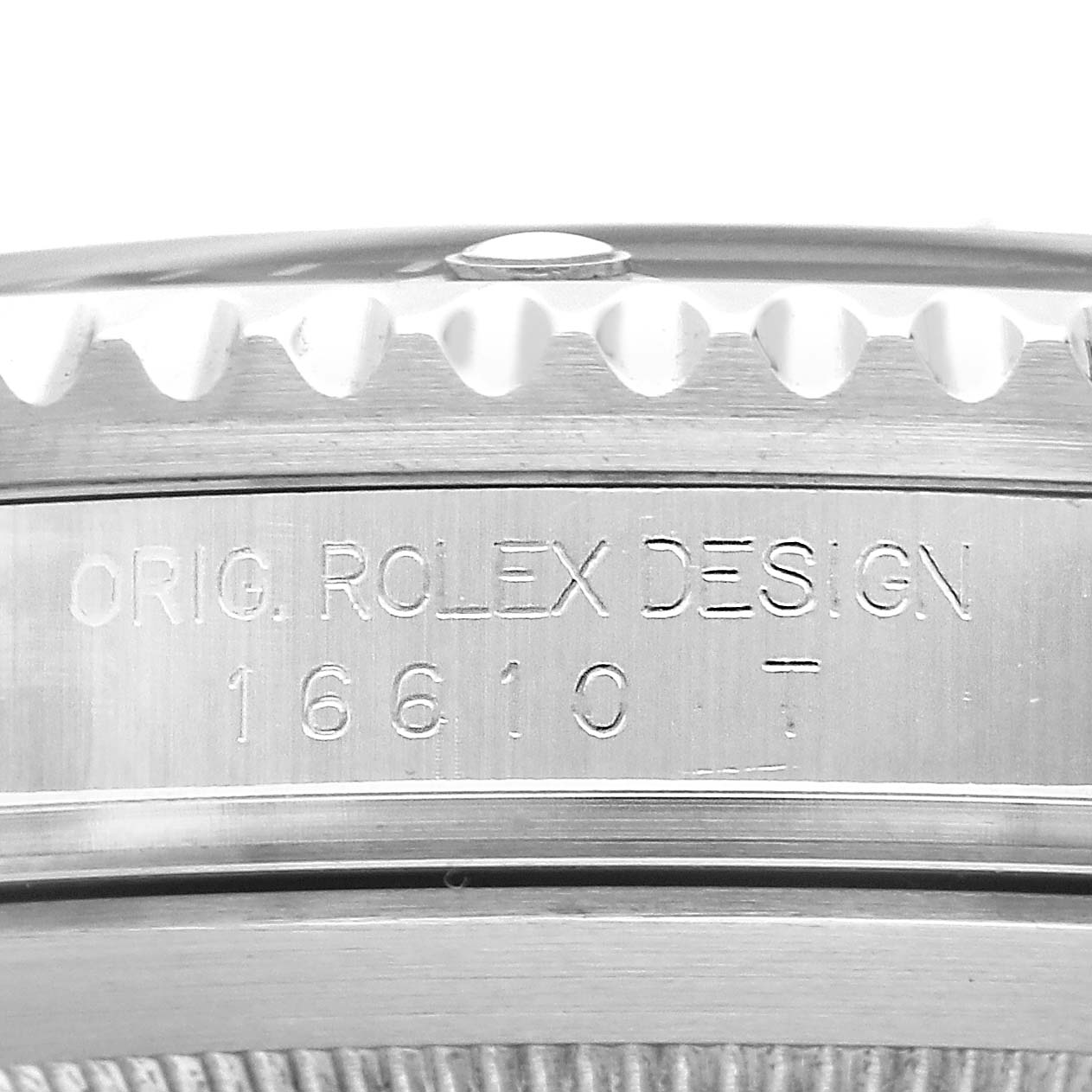 The angle shows a close-up of the side of the Rolex Submariner 16610 T Men's Stainless Steel Black Dial, focusing on the engraved design and model number.