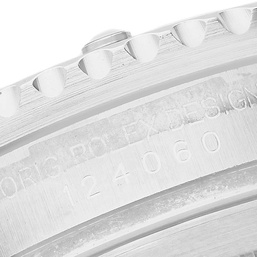 The image shows a close-up of the Rolex Submariner M124060-0001 Men's Stainless Steel Black Dial's engraved side, displaying the model number and part of the bezel edge.