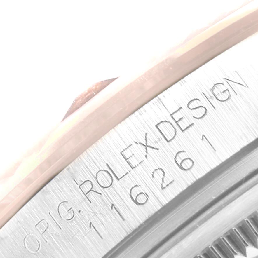 This image shows a close-up of the side of a Rolex Turn-o-Graph 116261 Men
s Steel and Gold (two tone) Silver Dial 116261 Men
s Steel and Gold (two tone) Silver Dial watch, highlighting the "ORIG. ROLEX DESIGN 116261" engraving.