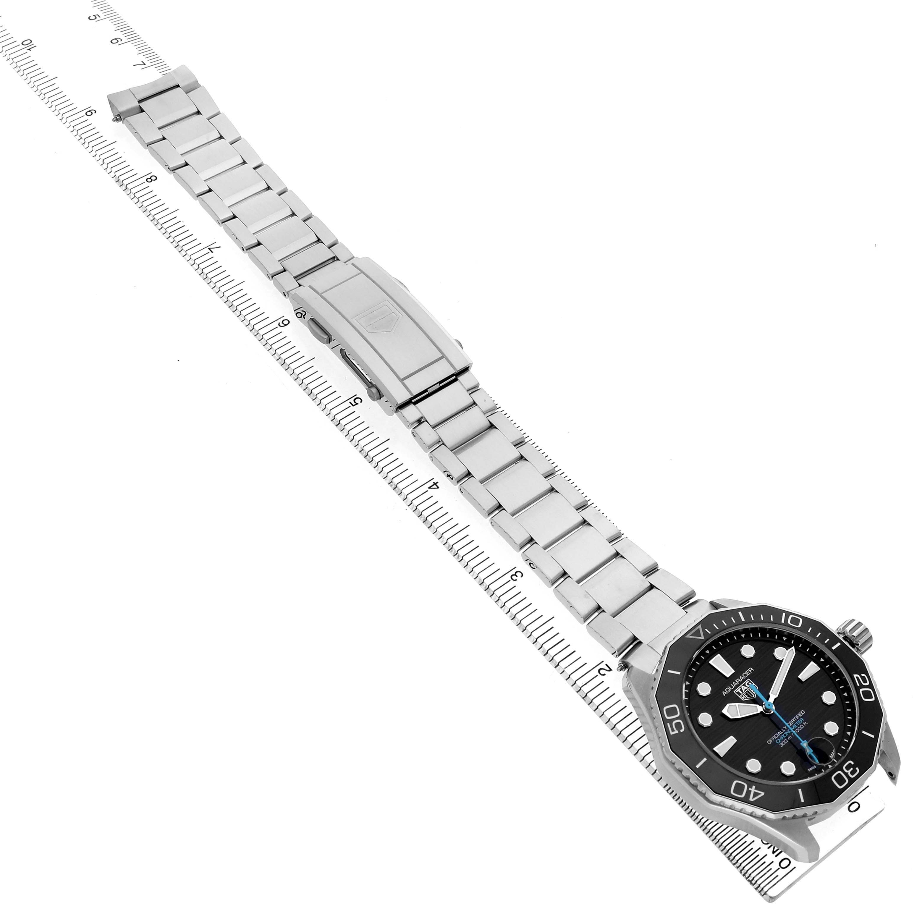 The Tag Heuer Aquaracer WBP5110.BA0013 Men's Stainless Steel Black Dial watch is shown diagonally, highlighting its face, bezel, bracelet, and clasp.
