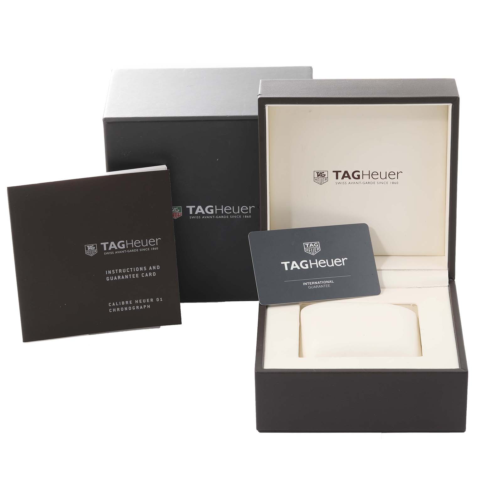 The image shows the packaging, instruction manual, and guarantee card for a Tag Heuer Carrera CAR201T Men's Stainless Steel Blue Dial CAR201T Men's Stainless Steel Blue Dial watch, but the watch itself is not shown.