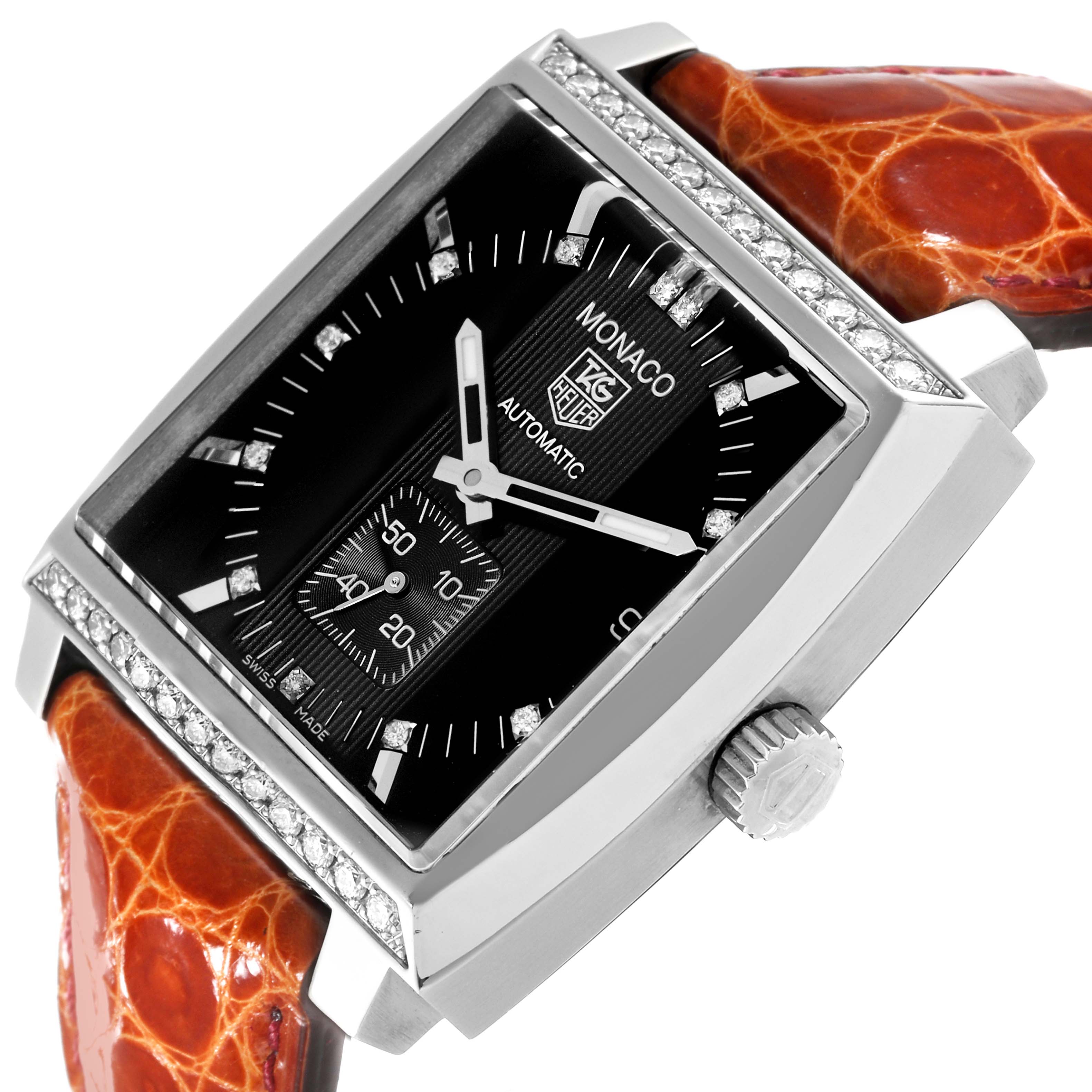The Tag Heuer Monaco 63480 Men's Stainless Steel Black Dial 63480 Men's Stainless Steel Black Dial watch is shown at an angled view, highlighting its rectangular face and orange leather strap.
