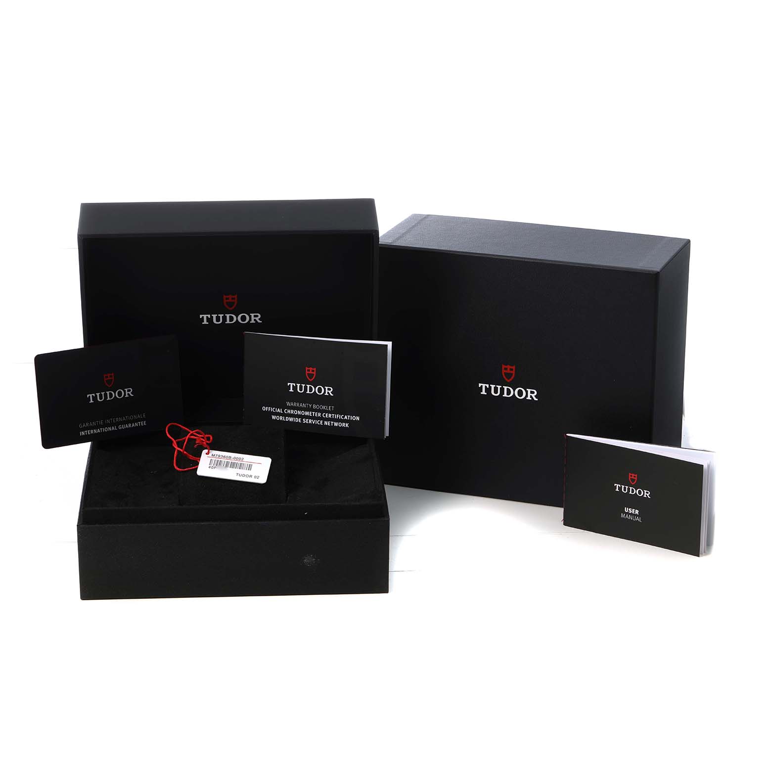 The image shows Tudor Heritage Chrono M79360B-0002 Men's Stainless Steel Blue Dial packaging, including boxes, manuals, and a warranty card.